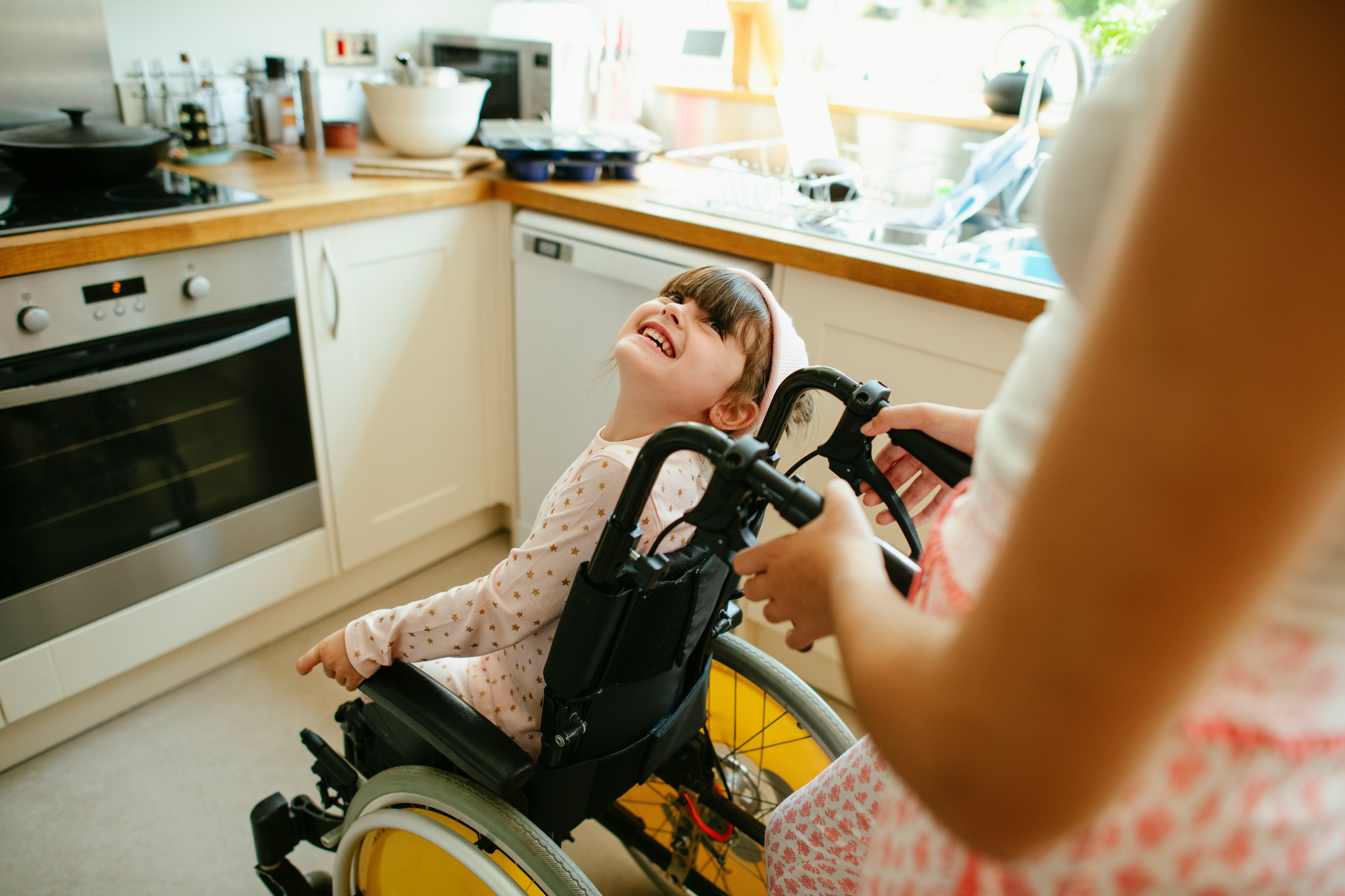Little girl in a wheel chair.