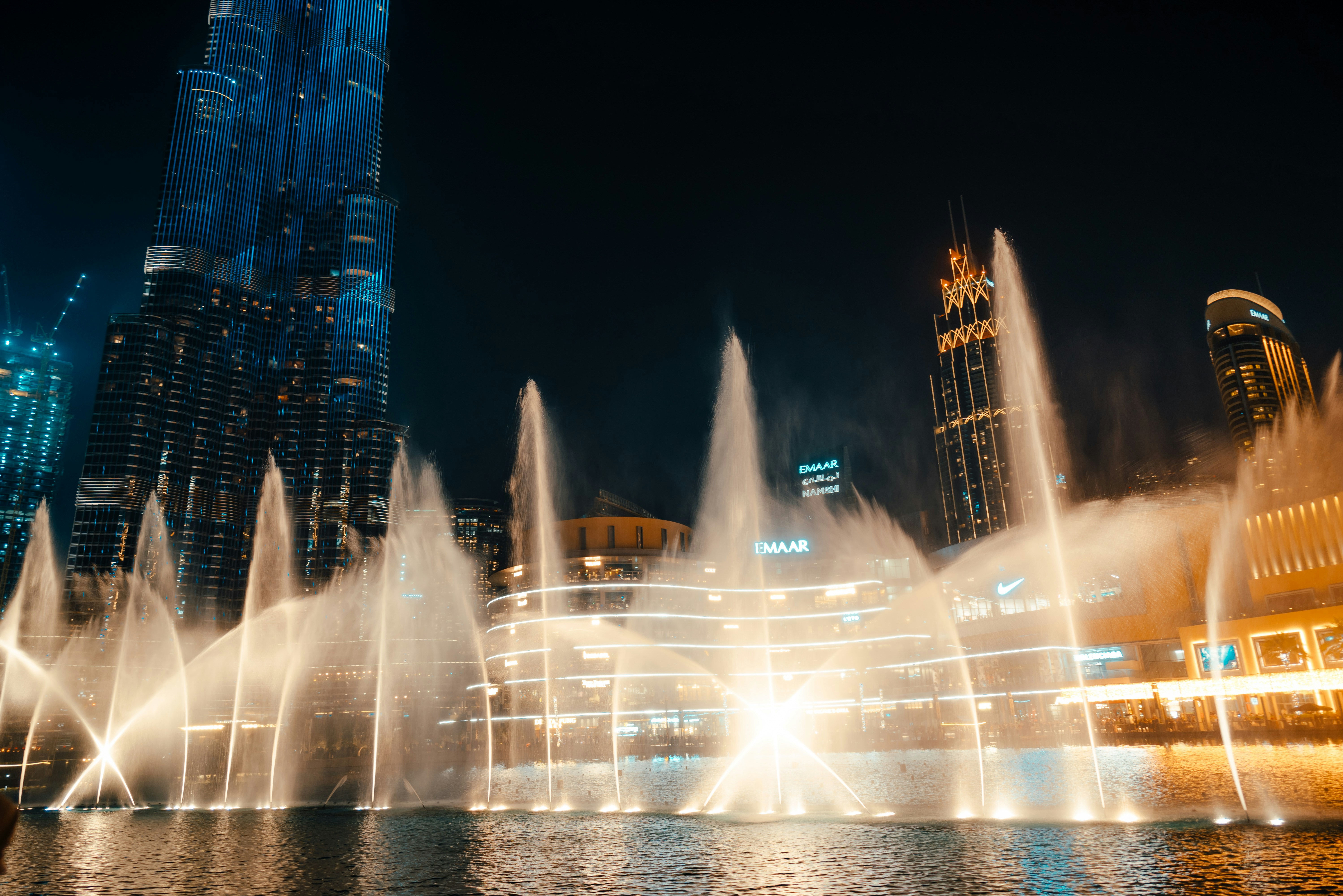 water fountain in the city during night time