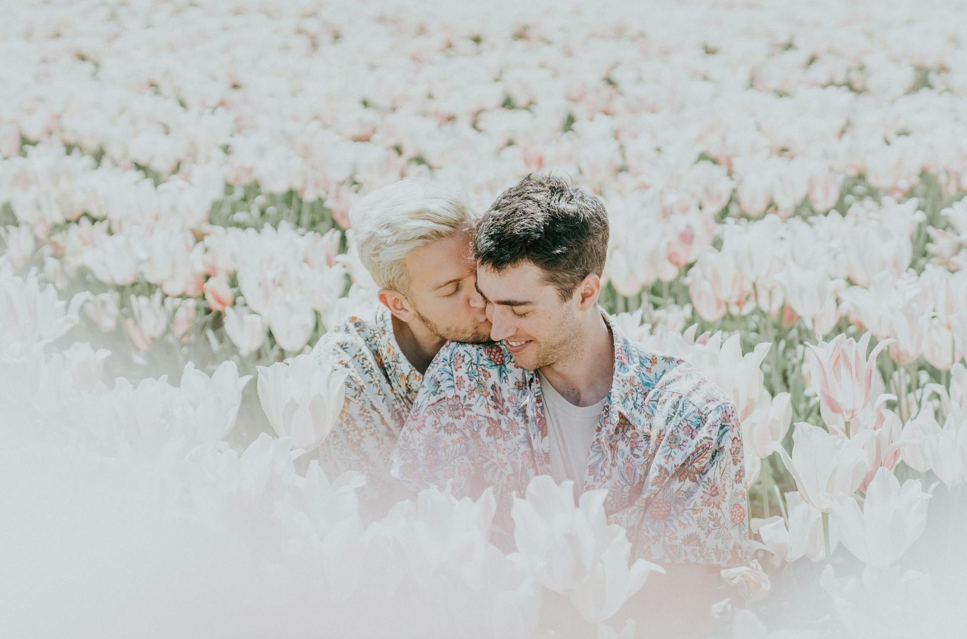 Queer couple in field