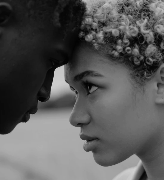 image of a man and a woman pressing their foreheads together