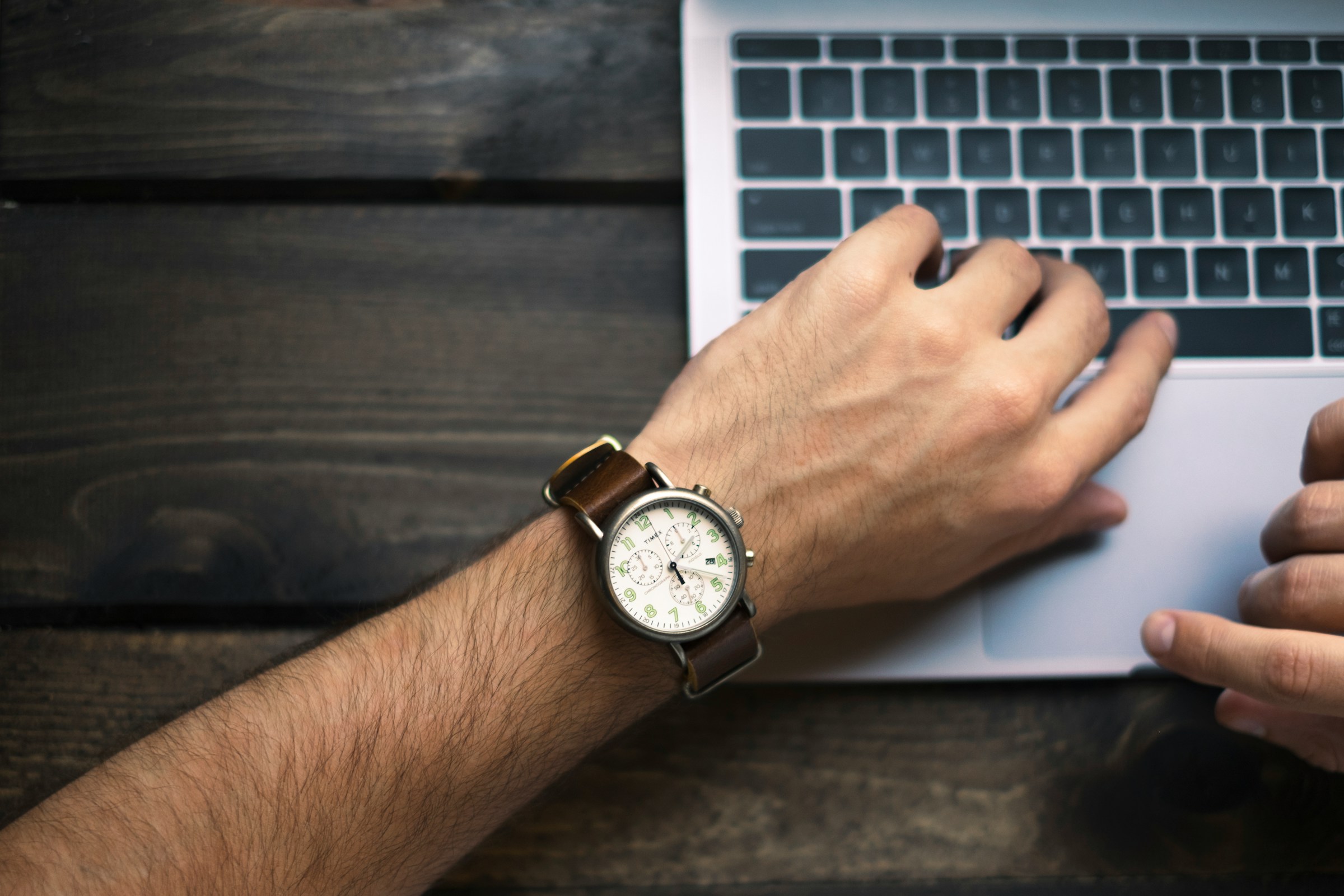 man looking at watch - How Long Does It Take To Write A Research 