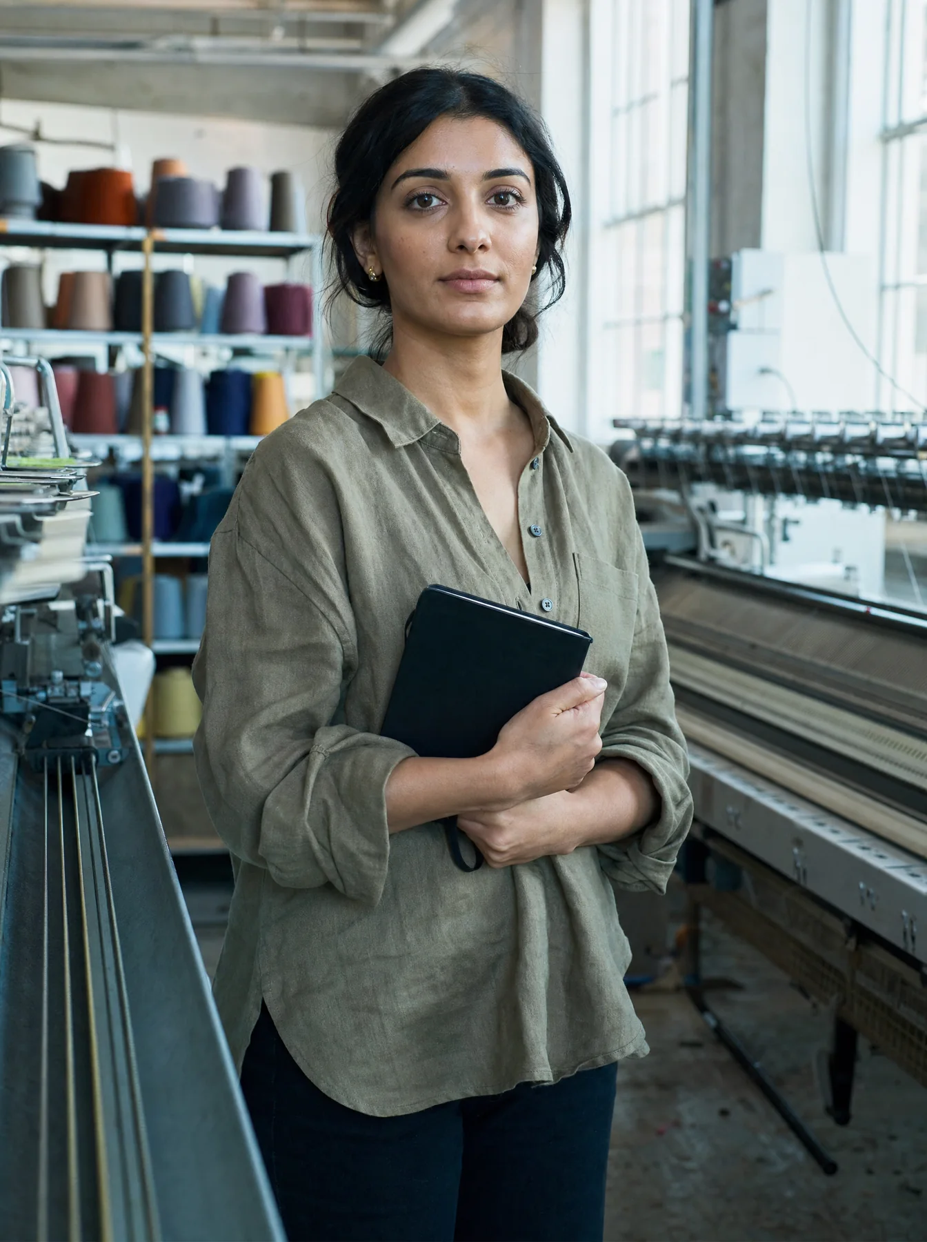 Nadia Hussain on the floor of a knitwear mill
