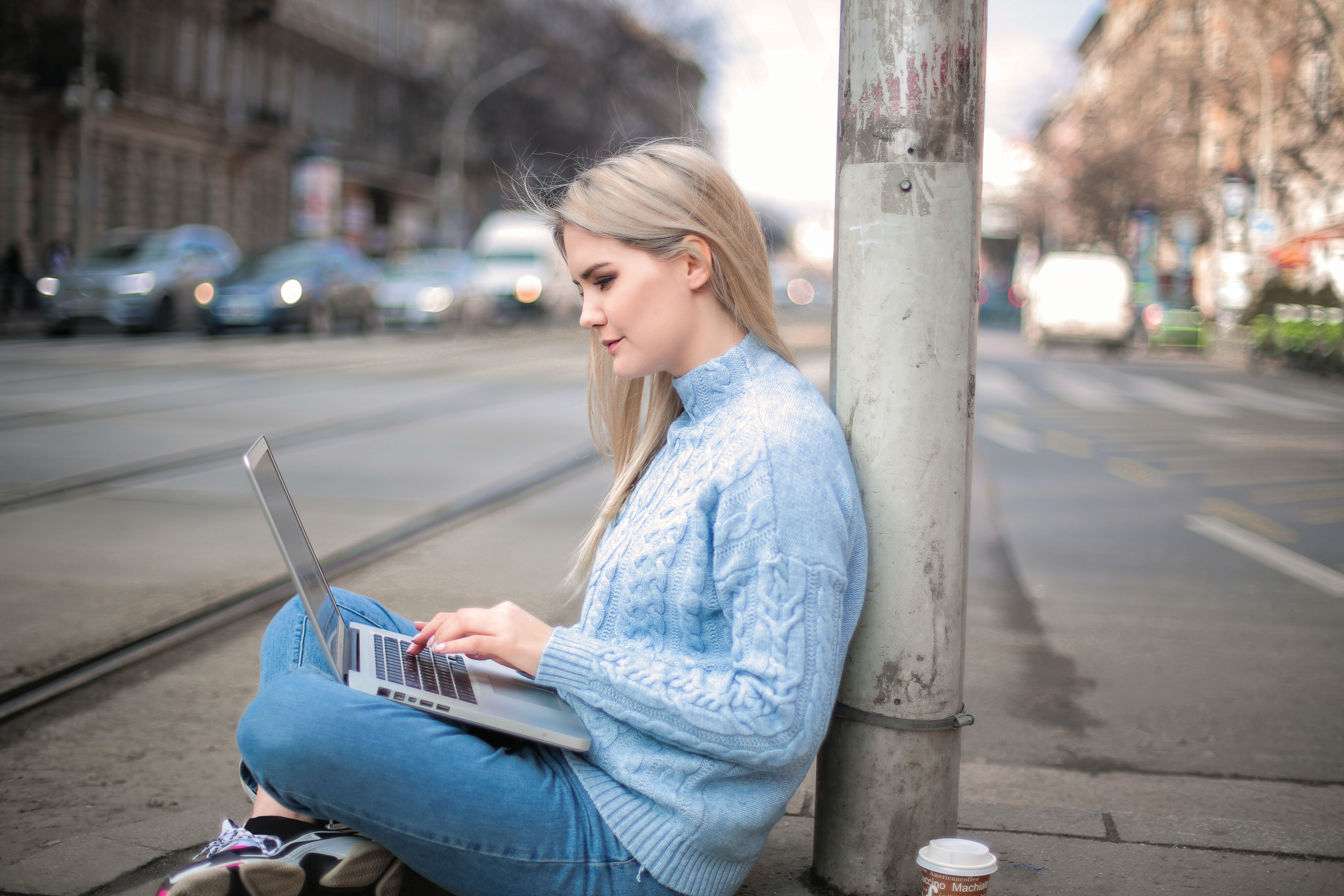 Woman in blue long sleeves boosting cold email success