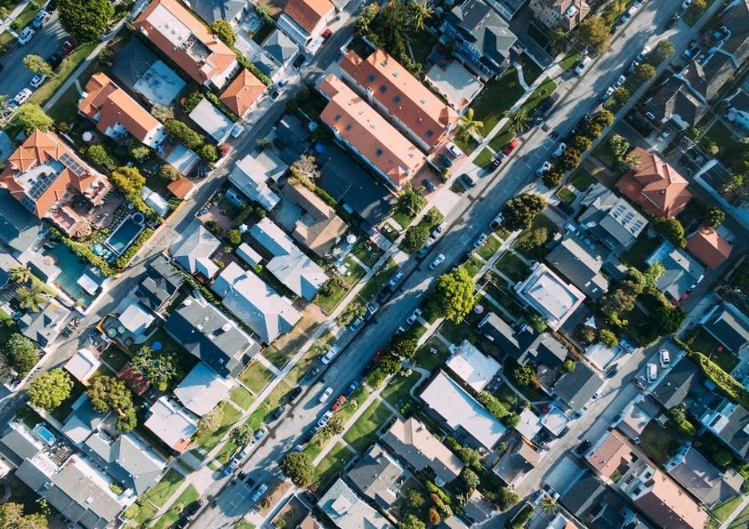 Aerial view of suburban houses and streets.