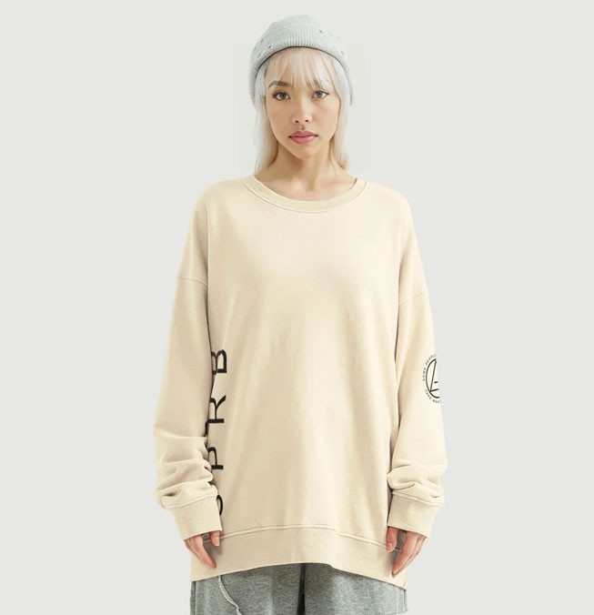 White oversized sweater for SPRB with young blond womand wearing a blue beany