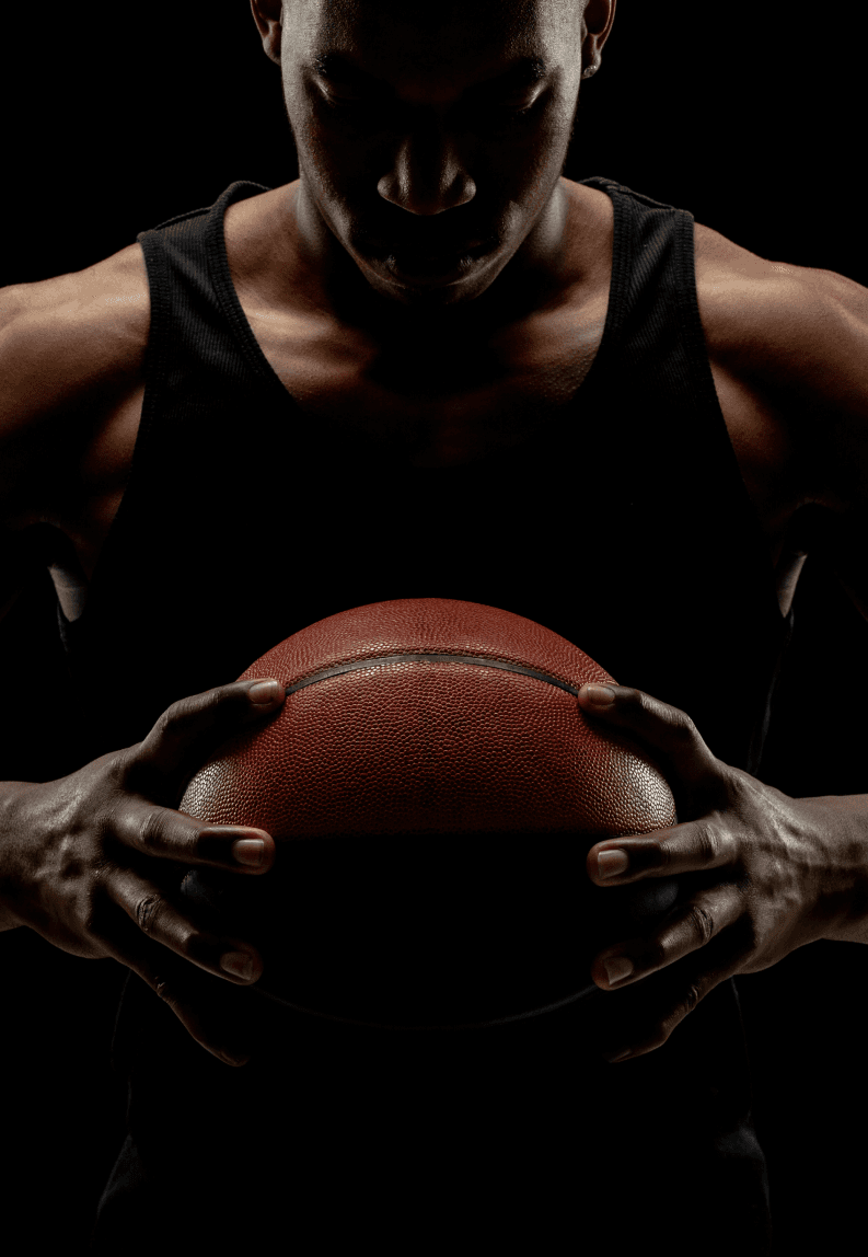 A woman in a straw hat stands in the grass