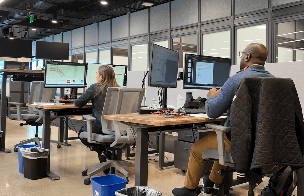 man drawing on dry-erase board