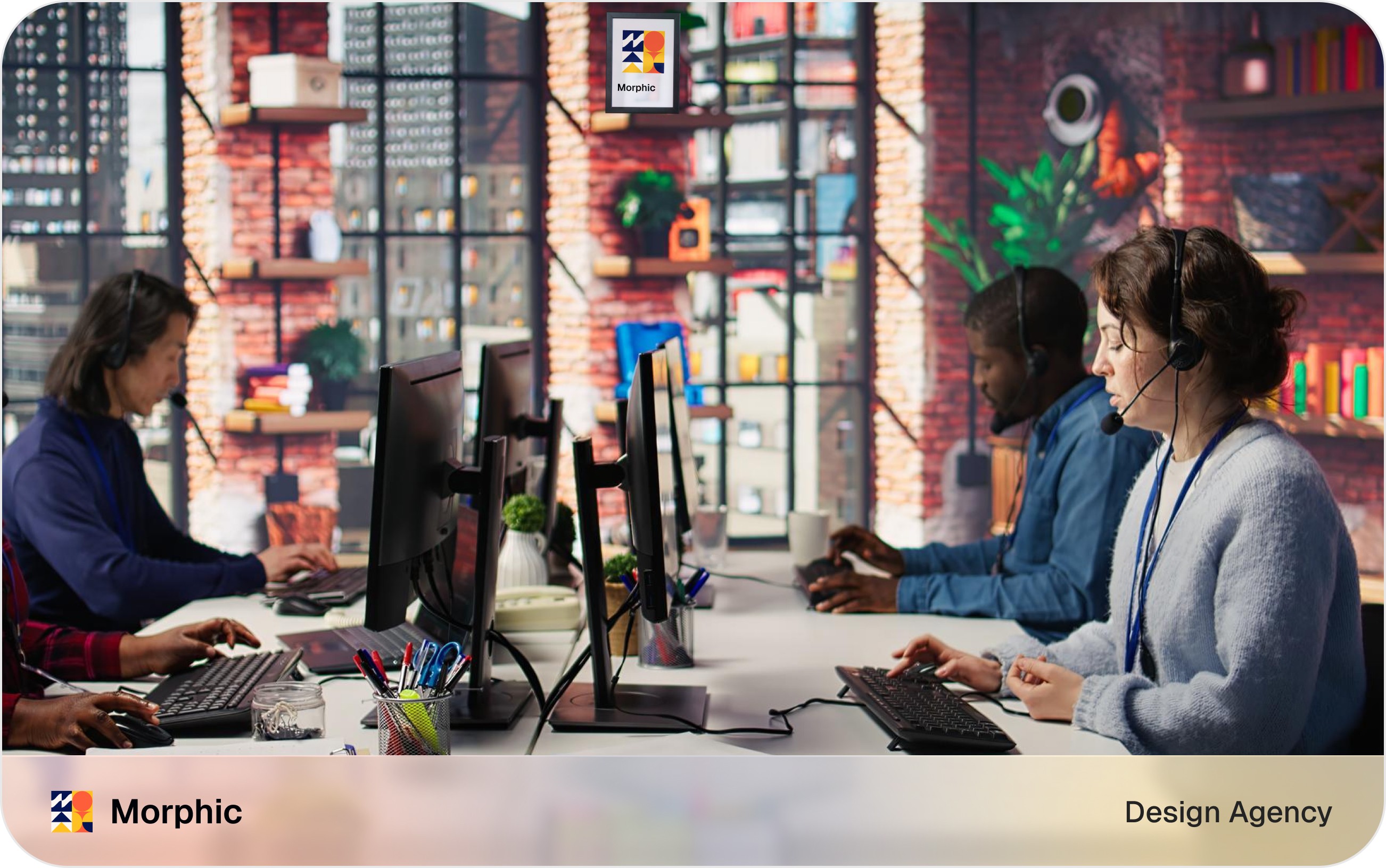 Design agency discovery call photo showing two professionals collaborating at a desk with a laptop and documents