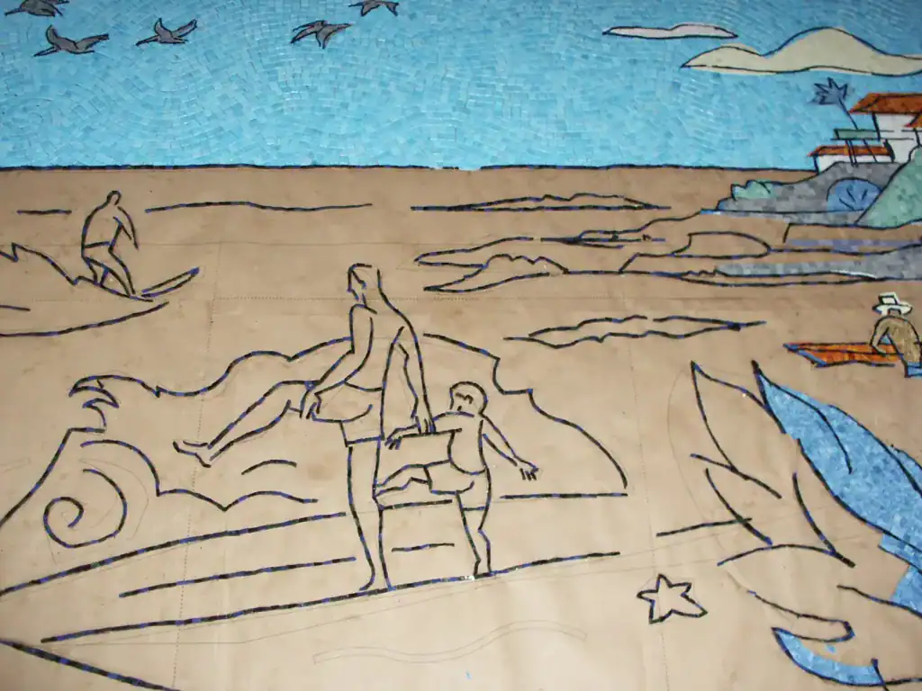 Mosaic mural at San Diego Airport depicting ocean waves and coastal scenery.