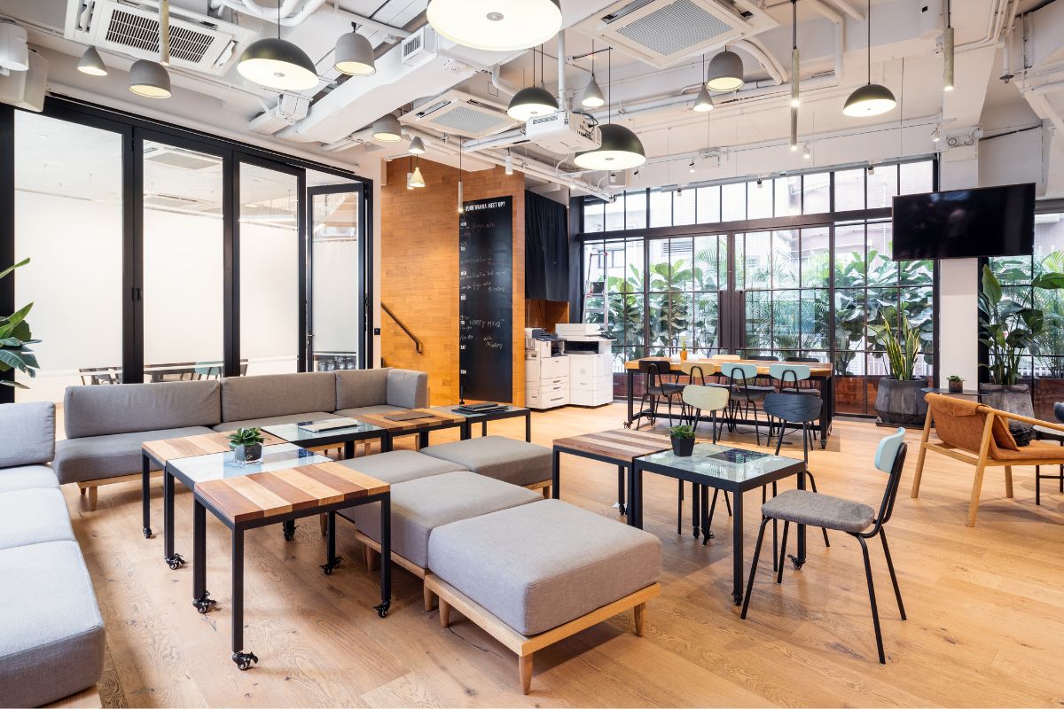 A large living room with tables and chairs.