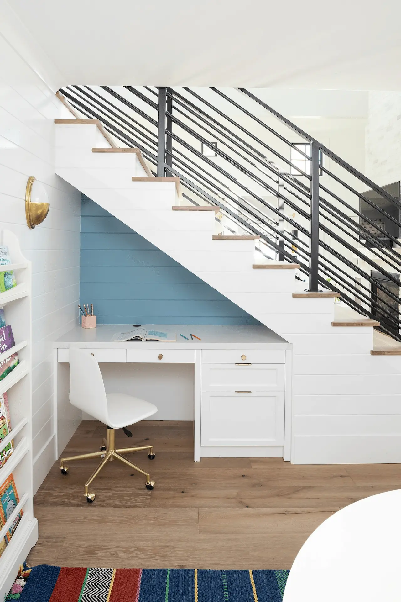 Under-stair nook with desk and shelving in North Tustin Remodel & Addition. Photo by Molly Rose.