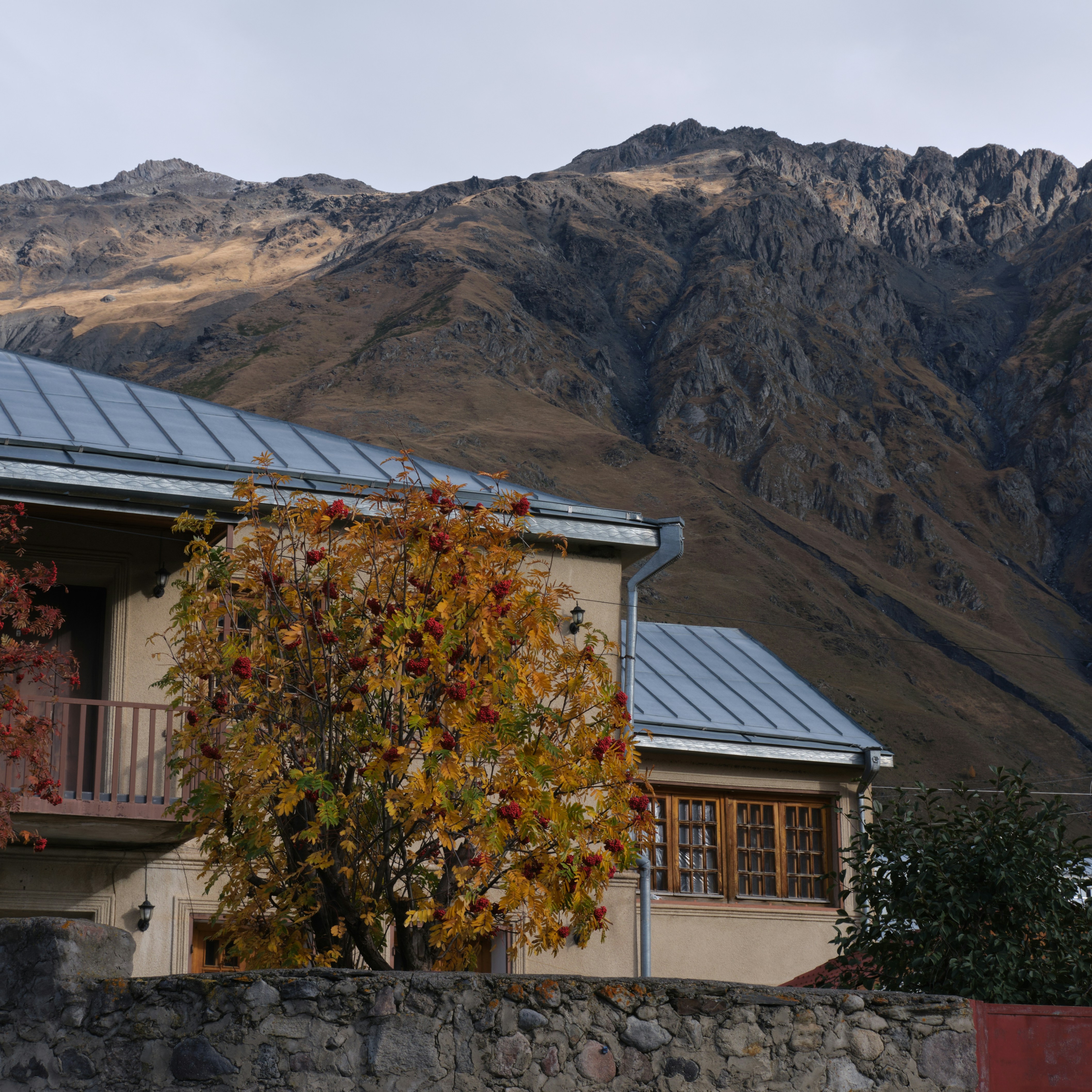 a house with a mountain in the background