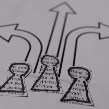 a close up of a piece of paper with arrows