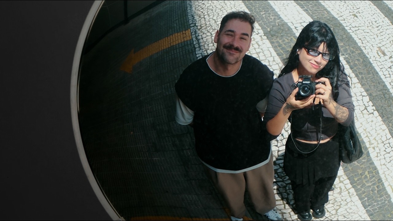 Man in the left side talking while images float in a masonry grid in the left side