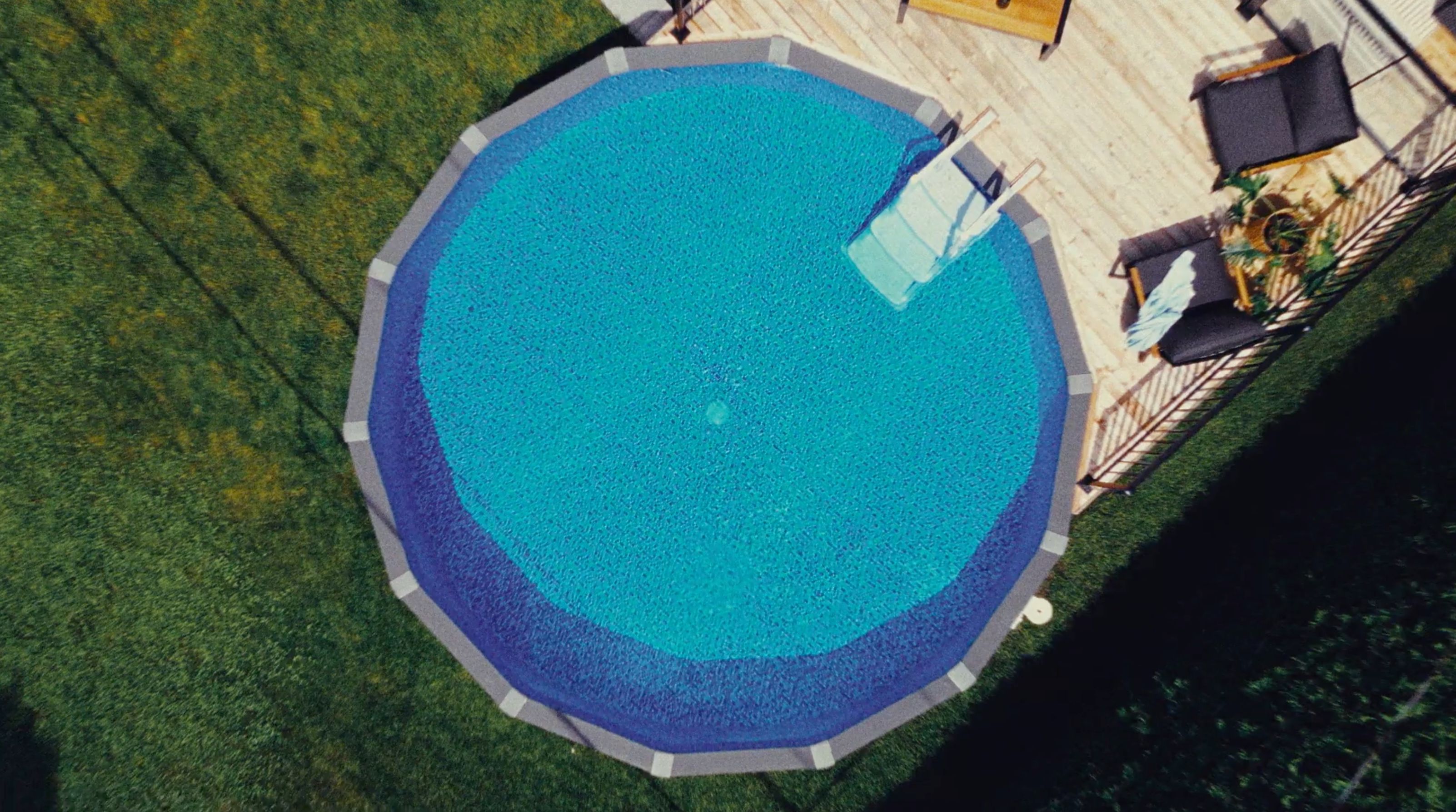 Aerial view of an inground pool in the yard of a house