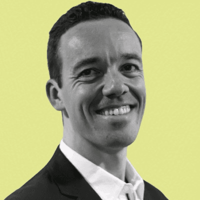 a man in a gray suit and white shirt