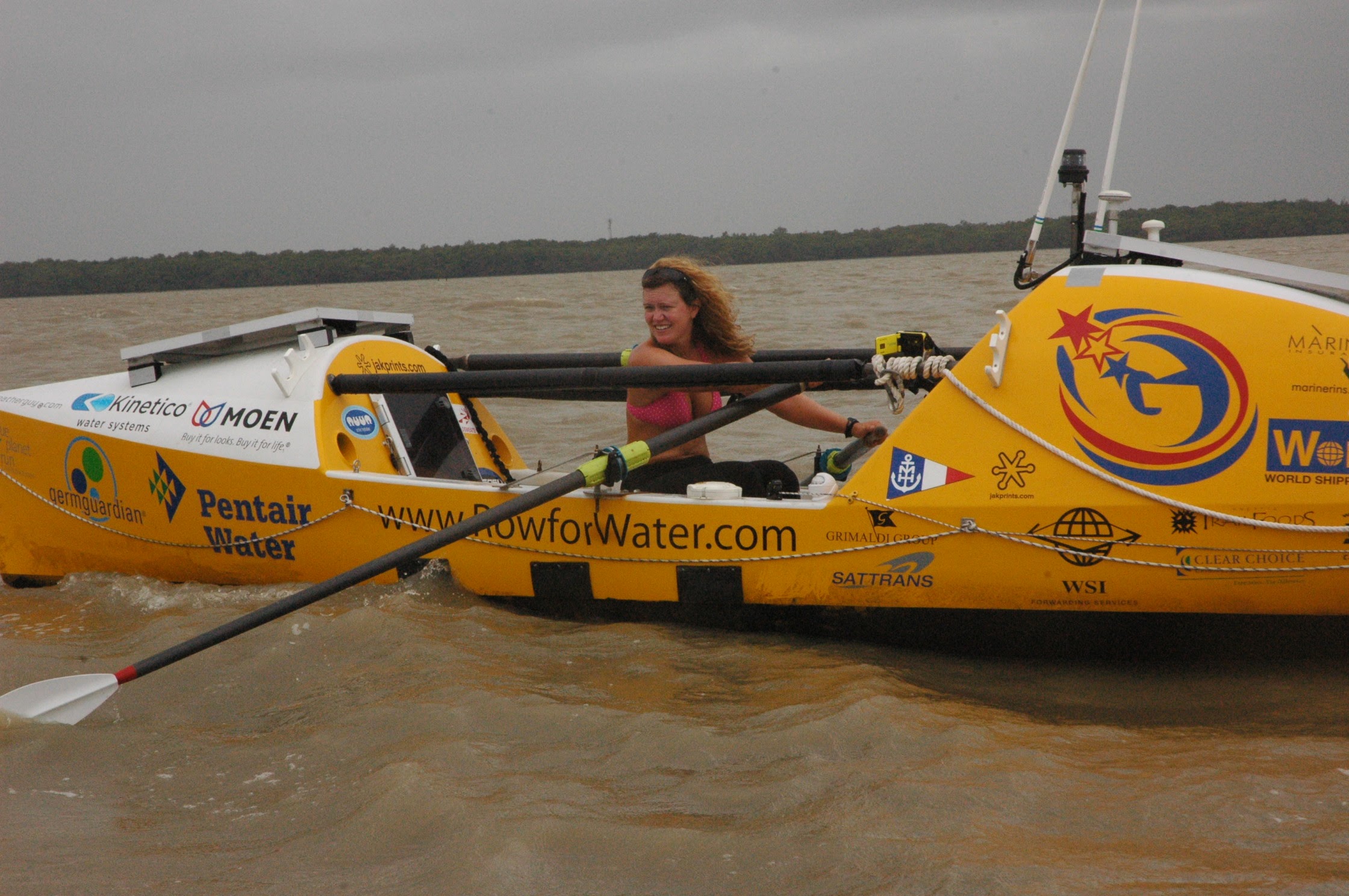 man wearing gray polo shirt beside dry-erase board