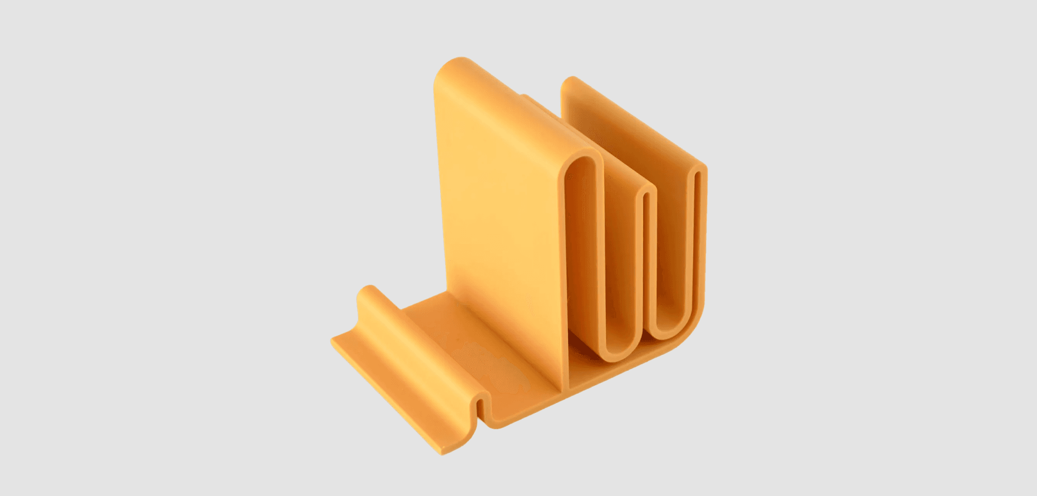Yellow silicone desk organizer with multiple slots for holding items