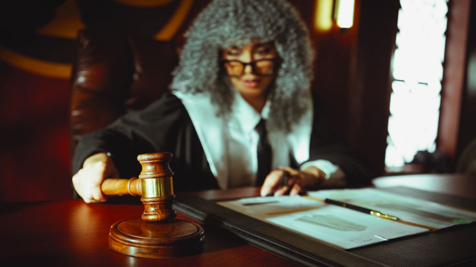 Formal courtroom setting with judge and attorneys