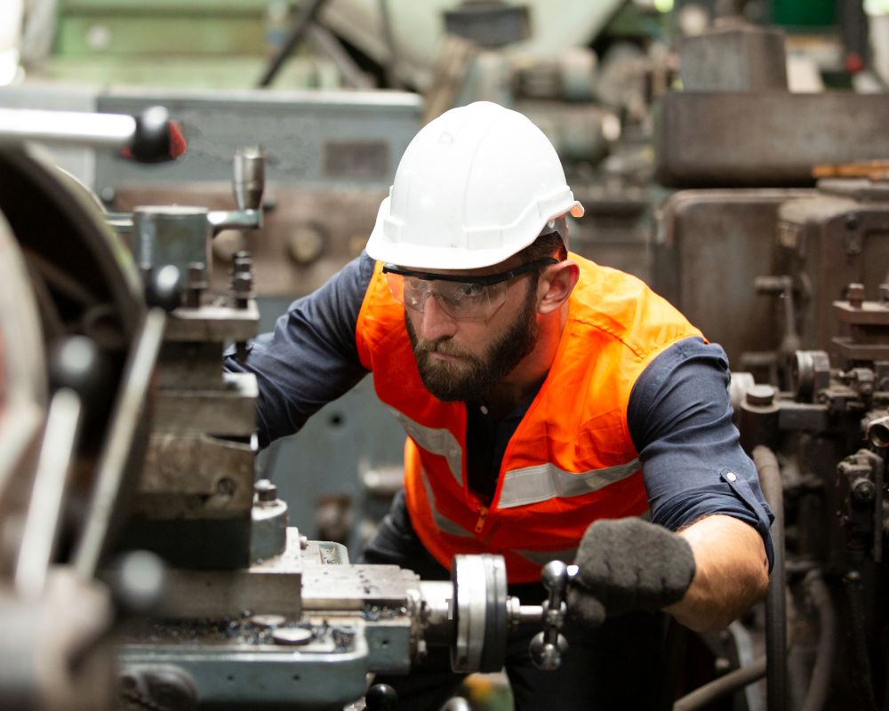 CNC Machinery with an employee working with it