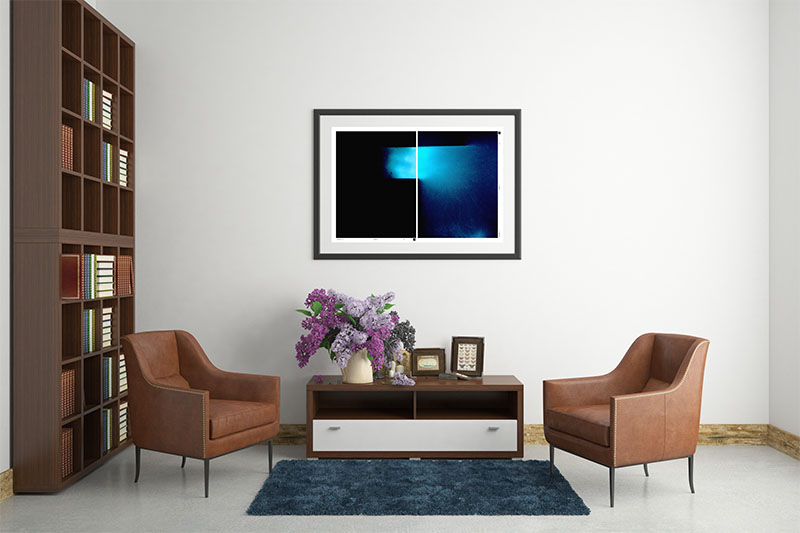 Living room, book case, two chairs and  beautiful painting comprised of two drak rectangles and a patch of blue flowing from one pane to the other as if light was a river. Titled The Message by Artist Silia