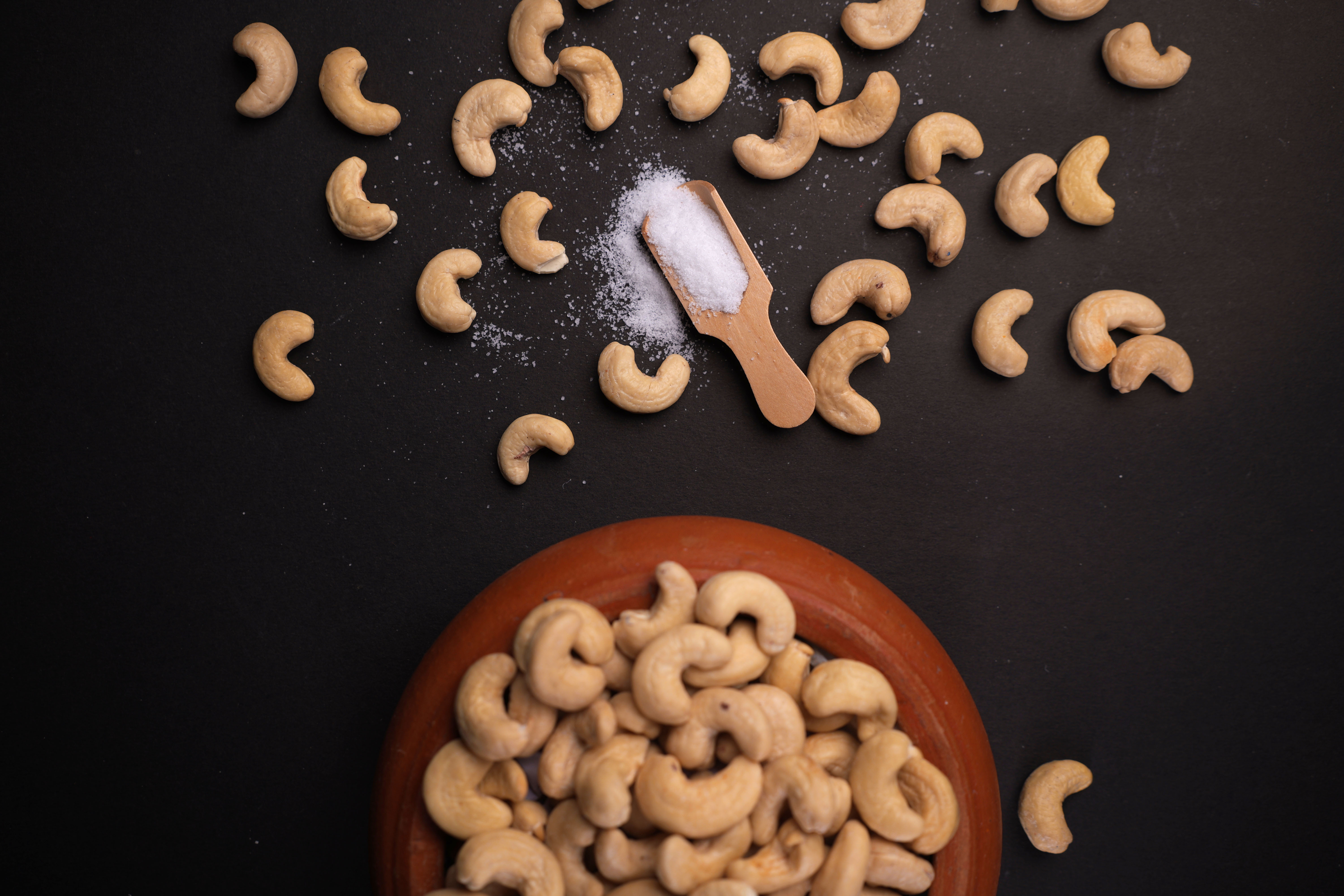A couple of bowls filled with food on top of a wooden table