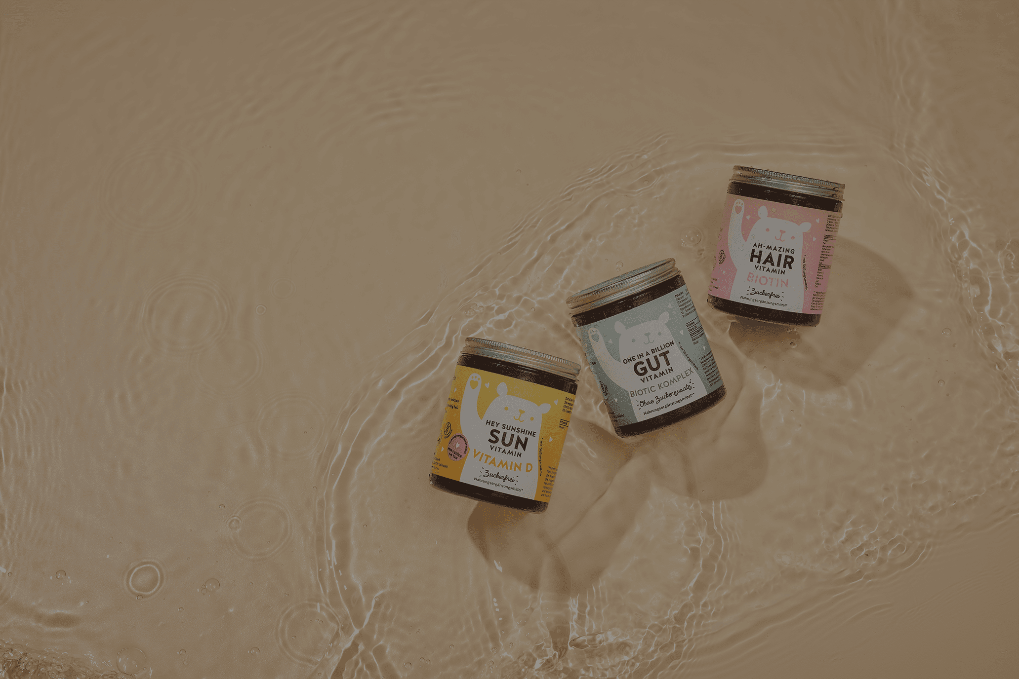 Three Bears with Benefits products lying on sand