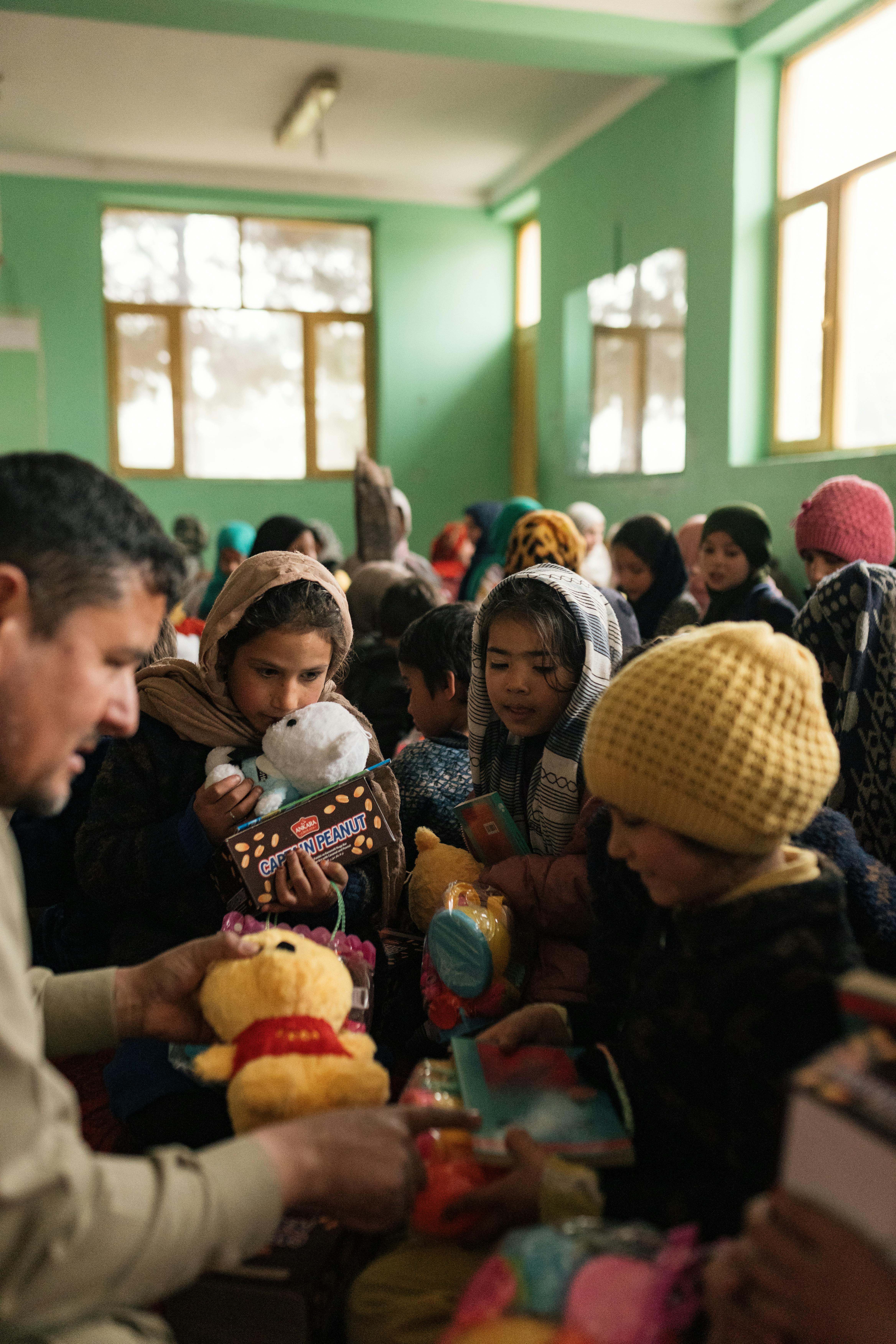 afghan kids with toys