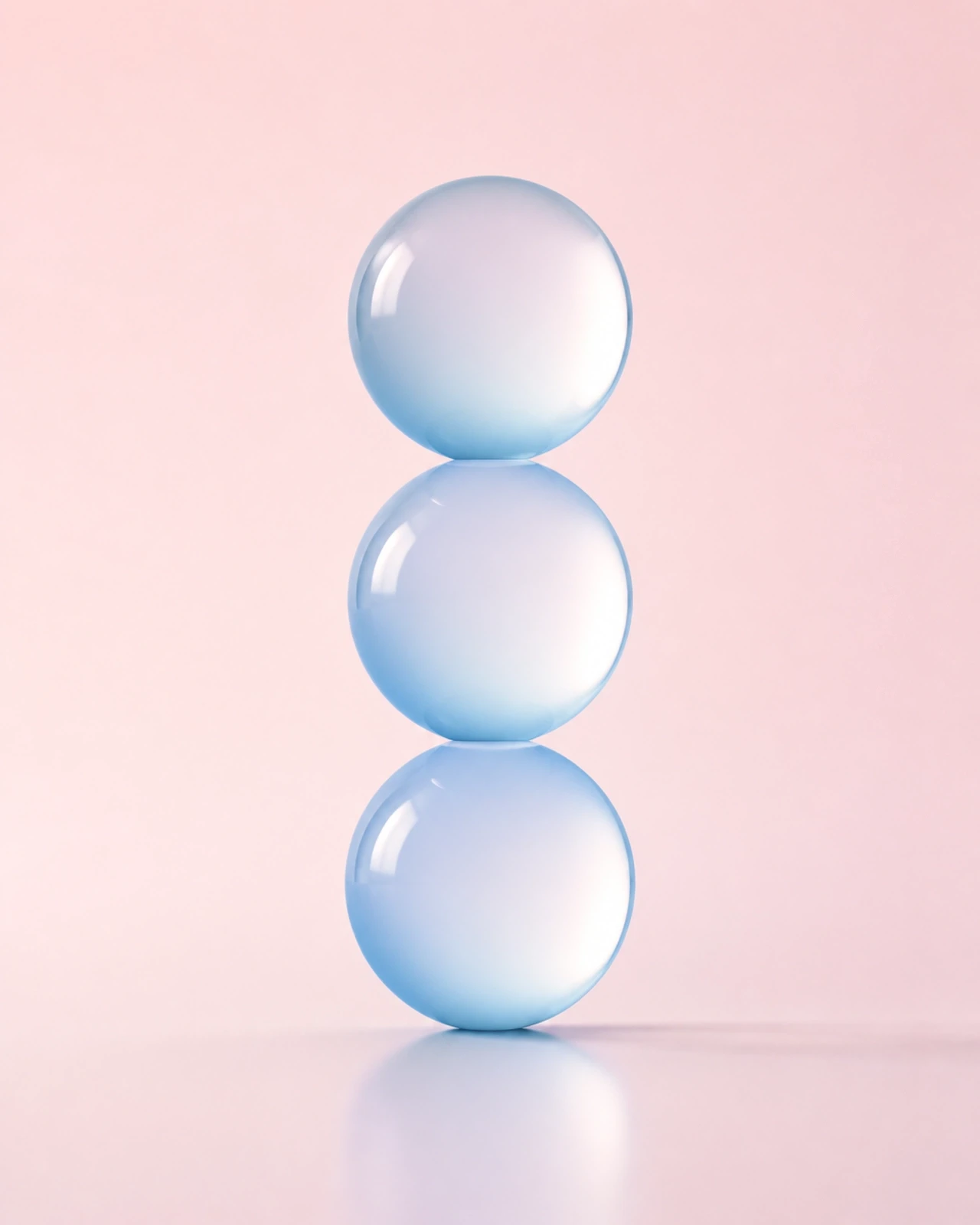 Minimalist digital illustration of a stack of three smooth, semi-transparent spheres in pale blue and gentle white. Representing organizational readiness and alignment.