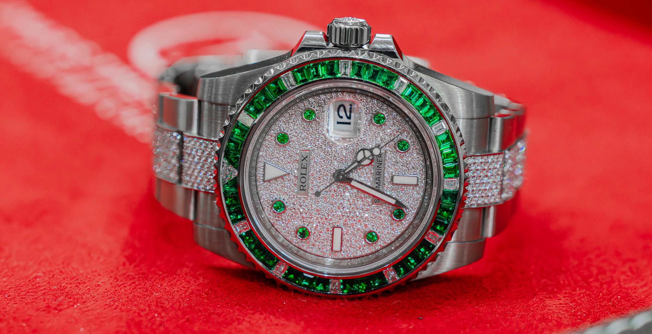 macro photography of round silver-colored and brown chronograph watch on stones
