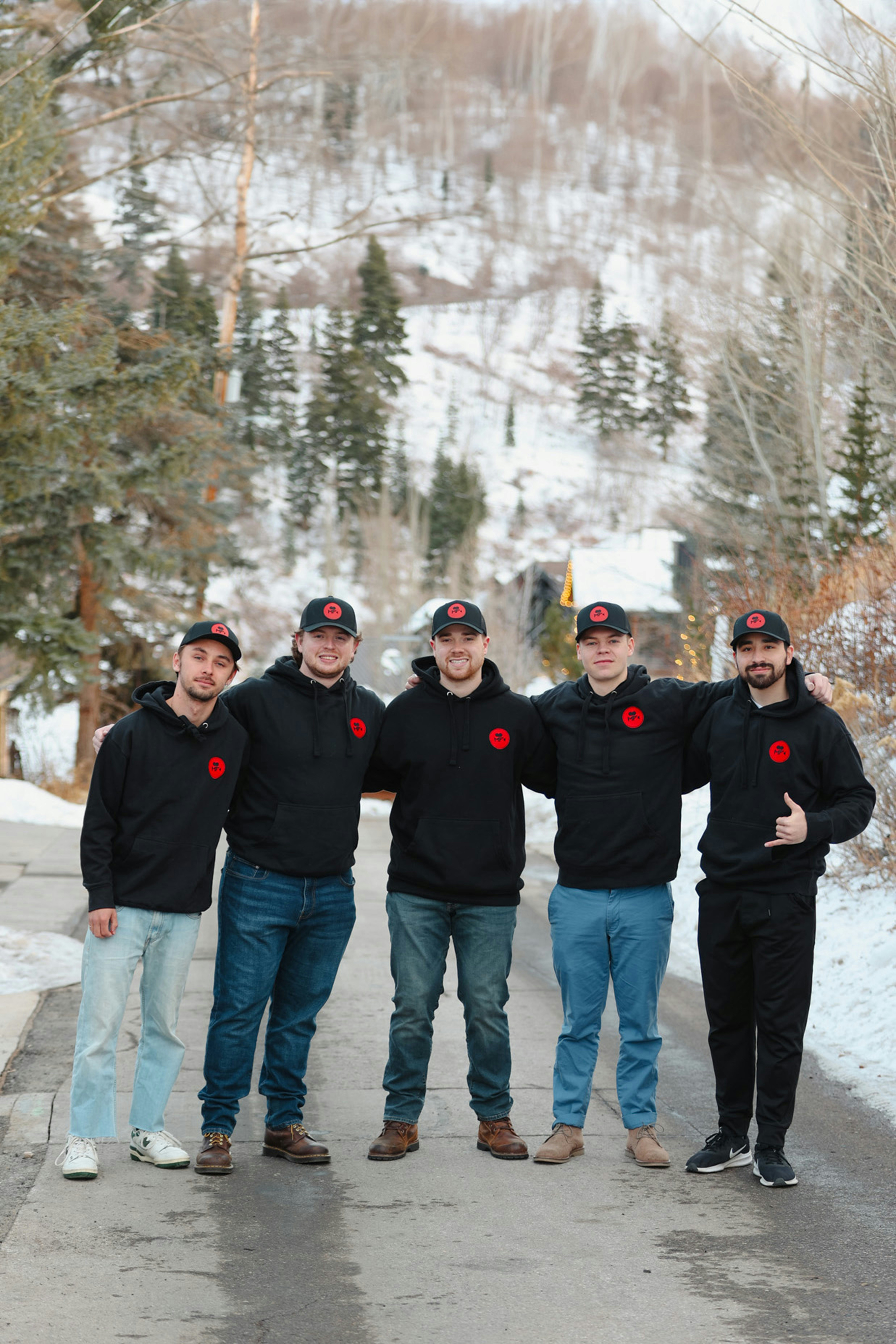 A group of men standing next to each other on a road