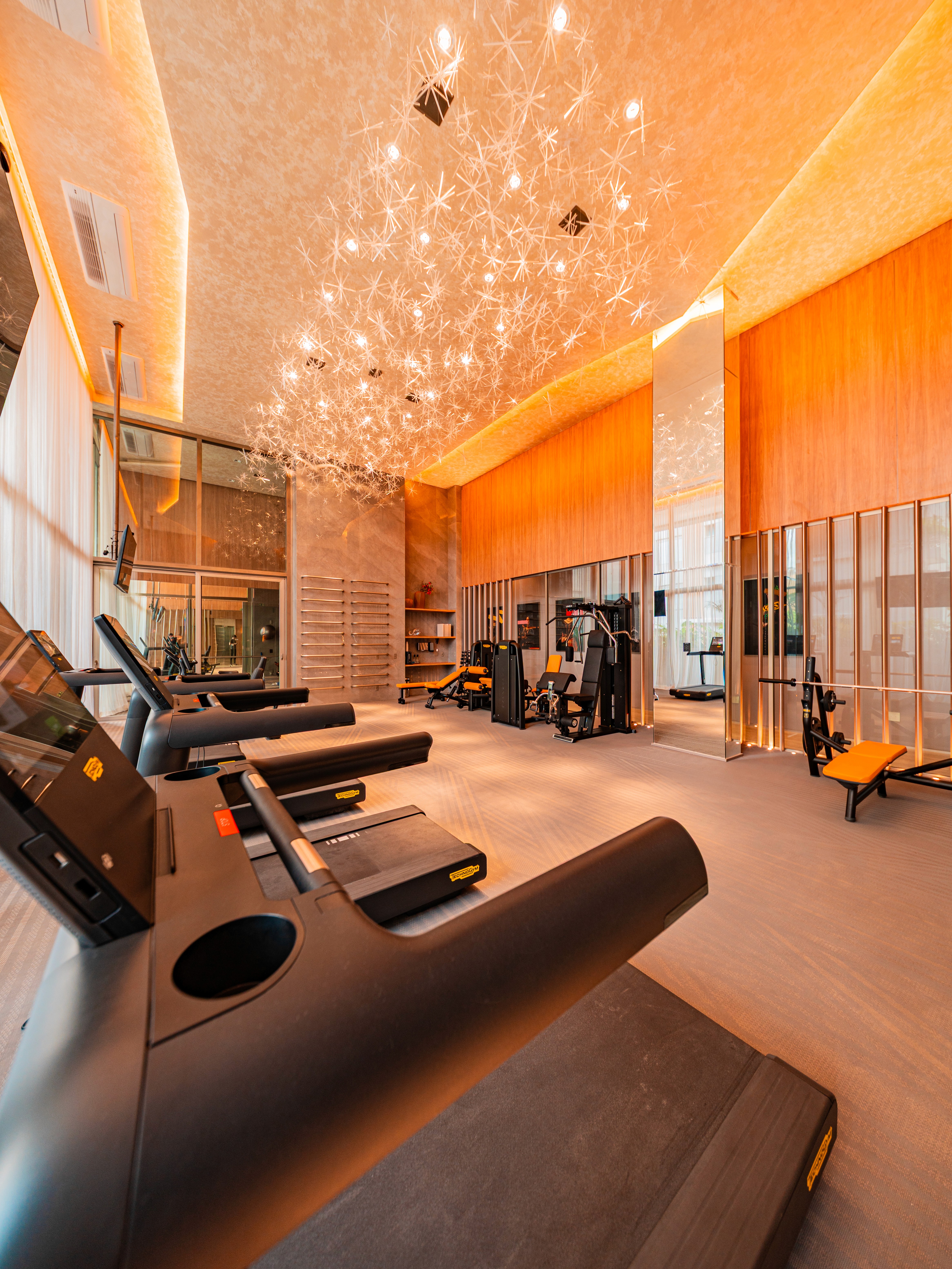 Curved modern skyscraper against a clear blue sky.