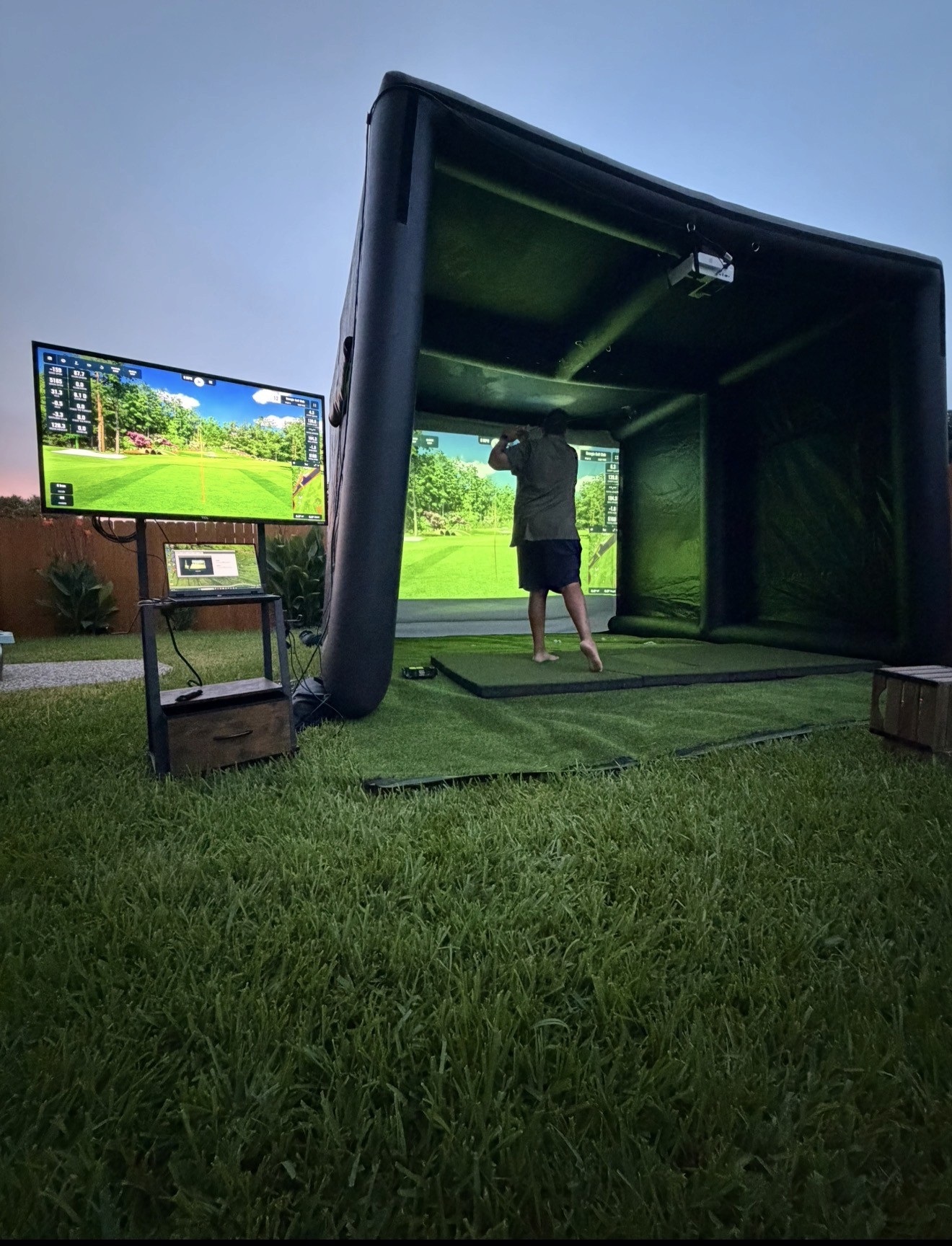 Guests playing a simulator game in front of a large screen