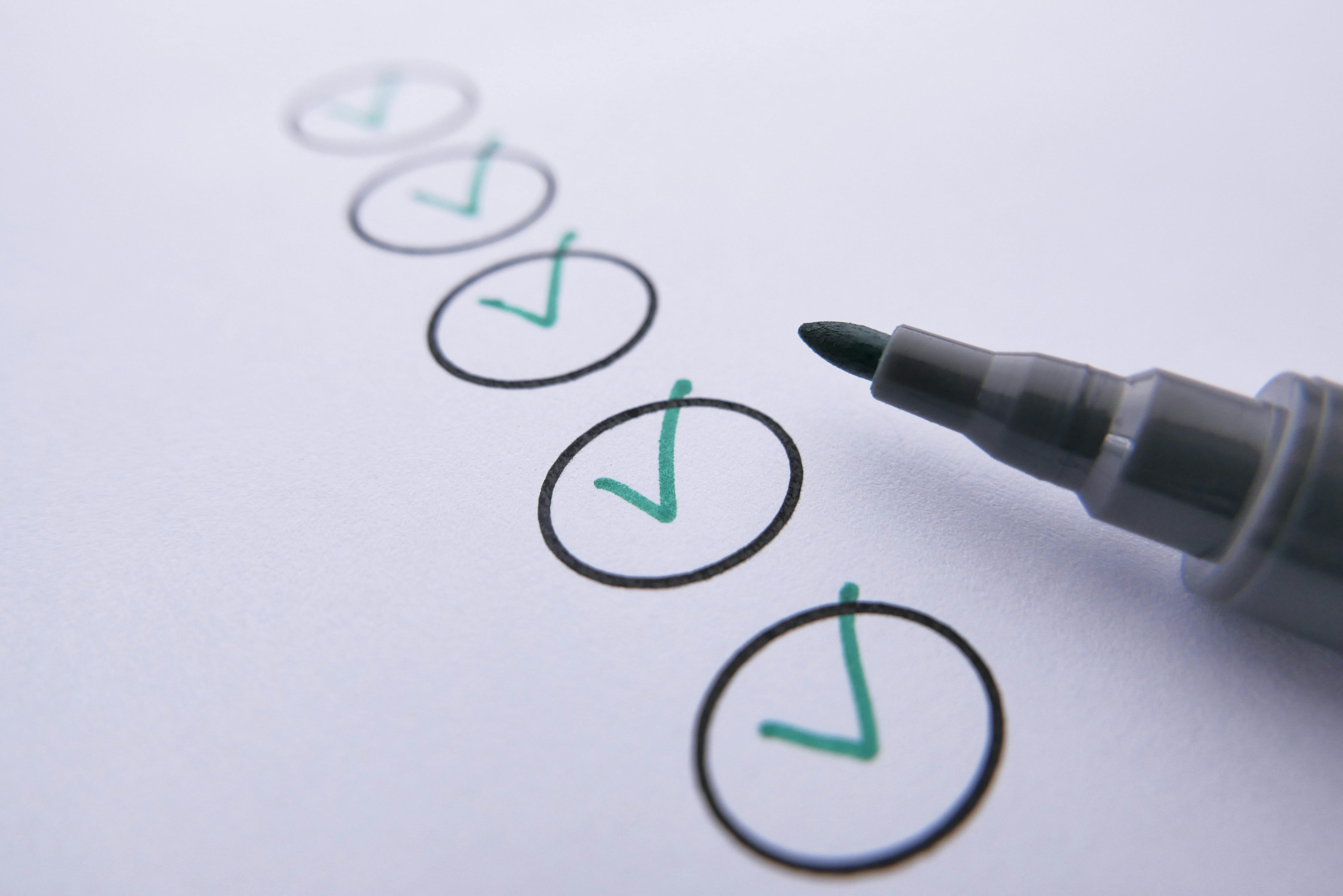 close-up-of-a-checklist-with-green-checkmarks-on-white-paper-using-a-marker. - towfiqu-barbhuiya (pexels)
