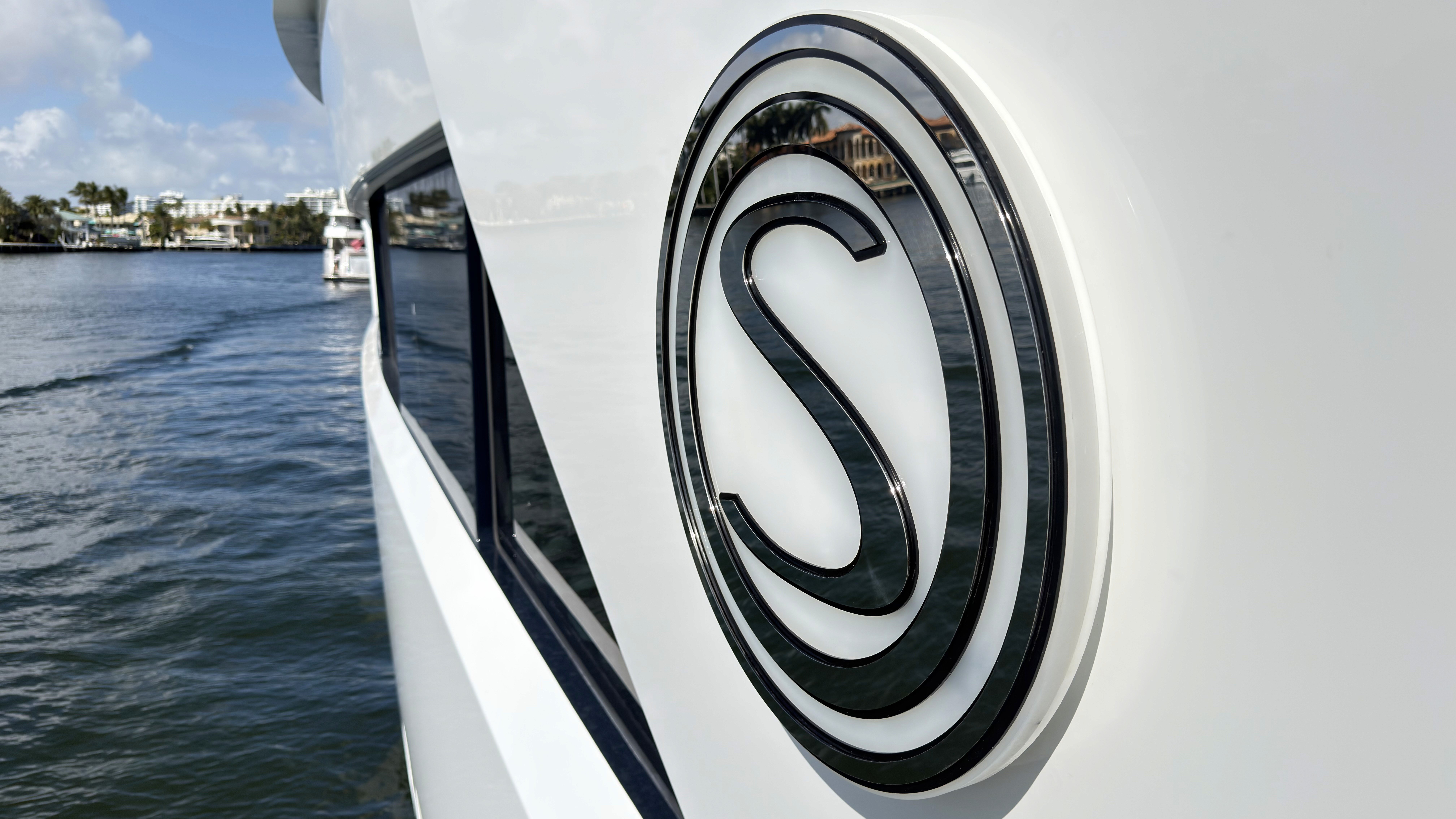 Custom black and white vinyl yacht graphics and lettering close-up