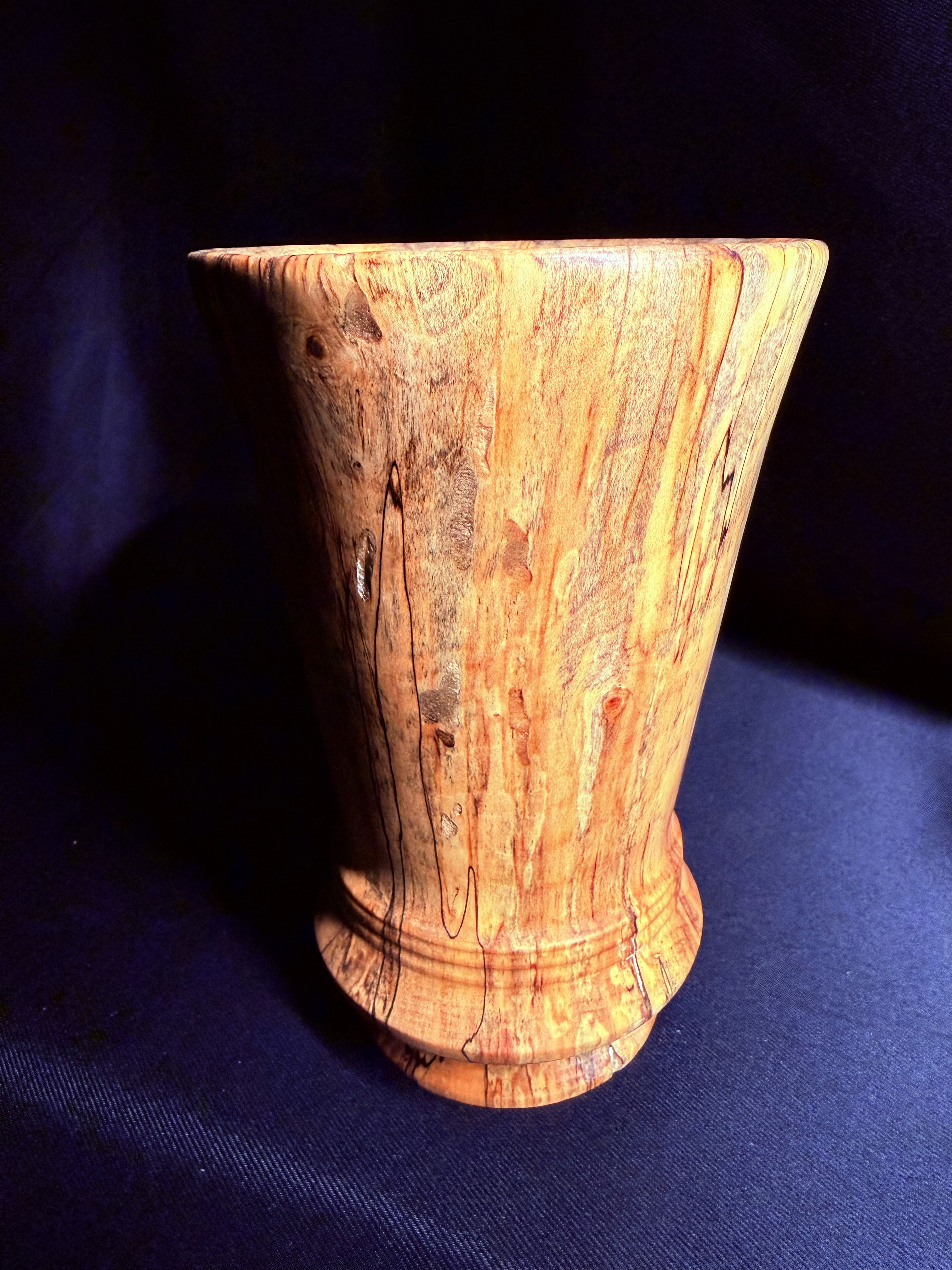 Detailed view of the spalted ash vase showing dark grain lines and natural wood figure.