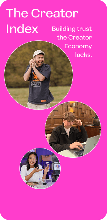 A neon-lit city street at night, shrouded in thick blue fog with glowing pink and purple signs illuminating the haze