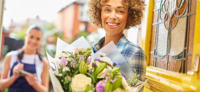 Lady receiving flowers Florist making it off on Delivery App