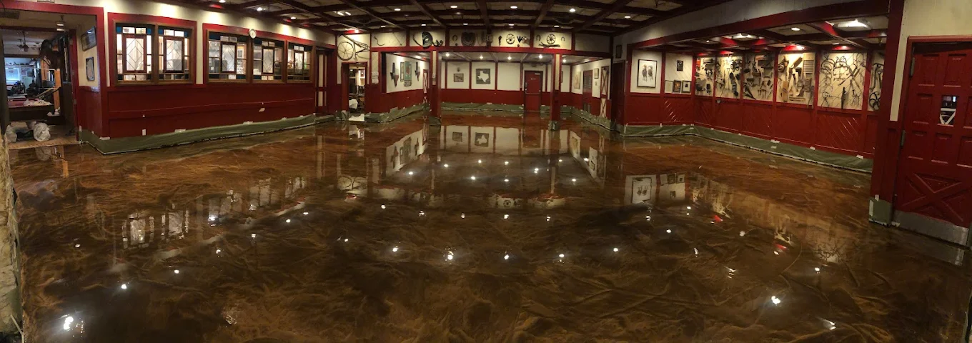 Metallic epoxy floor coating in large commercial warehouse