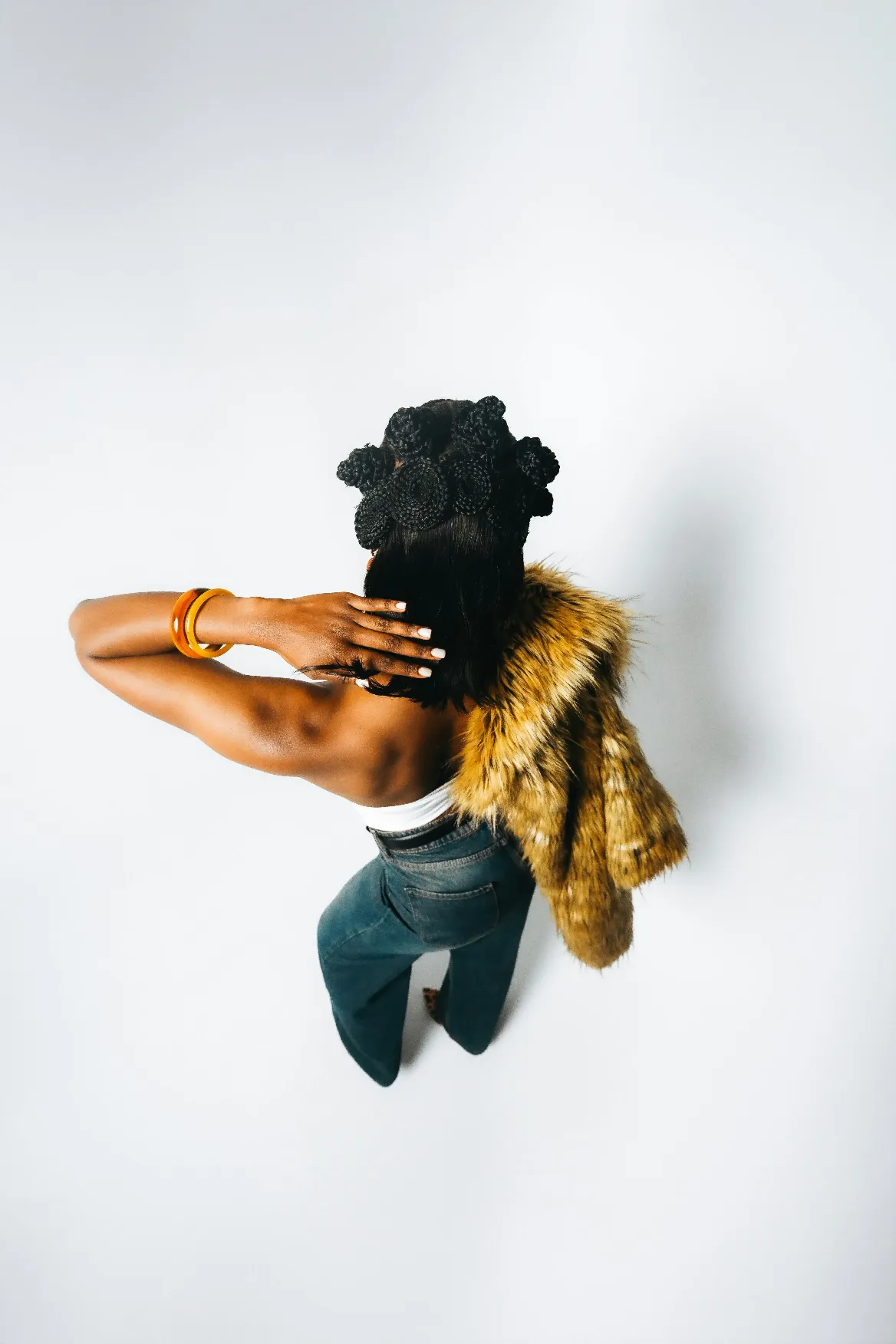 Portrait of a stylish girl with gold chain and crossed arms, bold fashion photography for Pharmapro identity