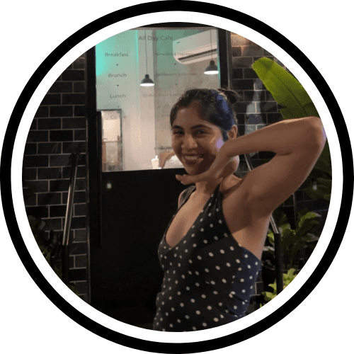 Portrait of a small brown dog on yellow background