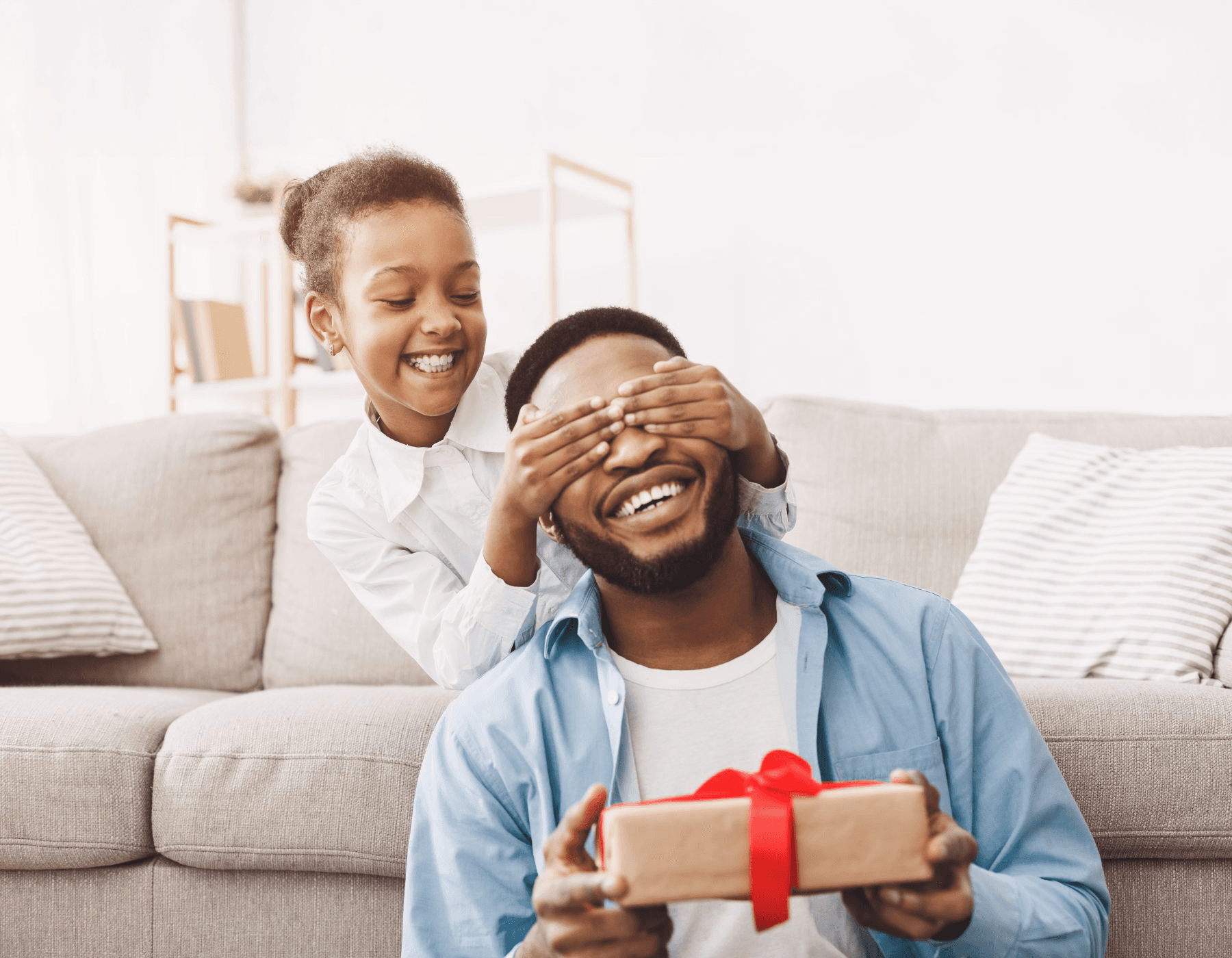 five children smiling while doing peace hand sign