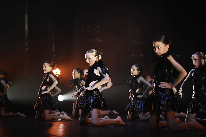 Junior Jazz students on stage performing the opening number