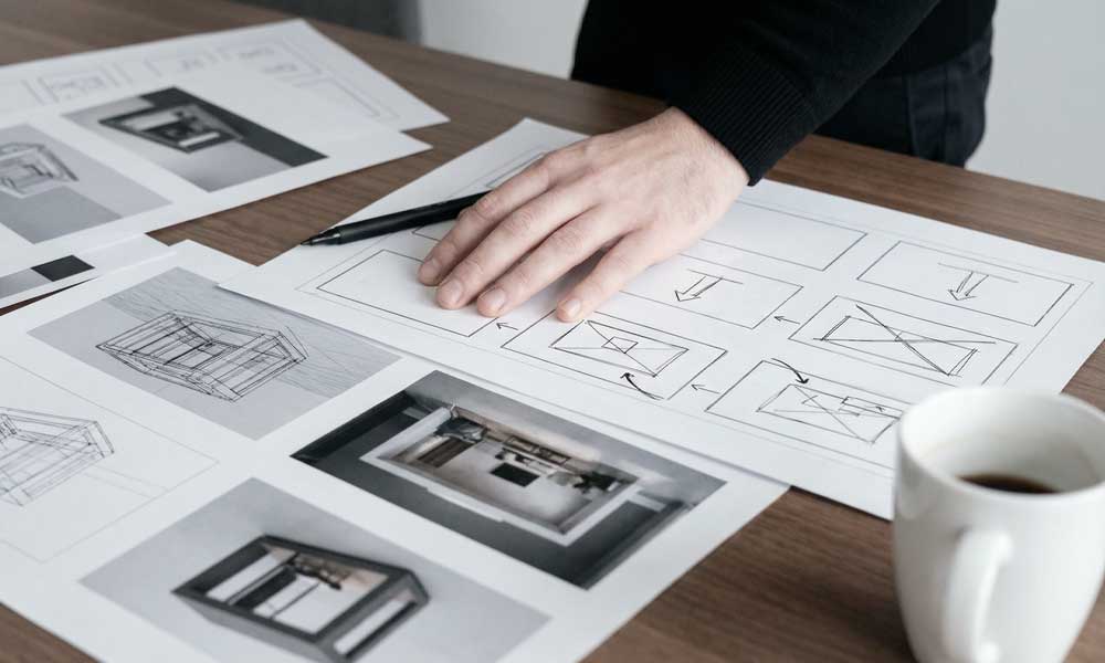 a pile of magazines sitting on top of a bed