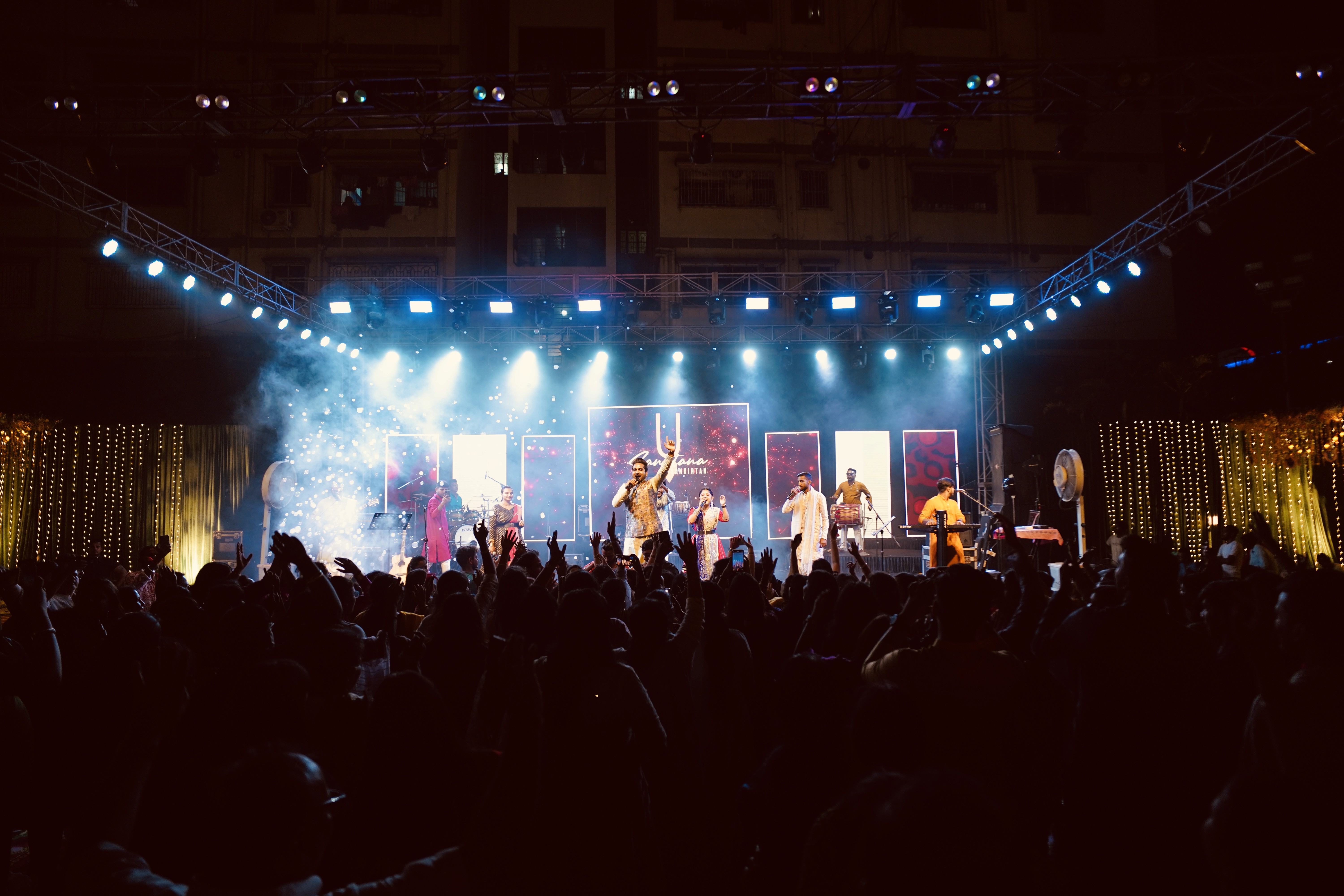 Audience raising hands at a live event