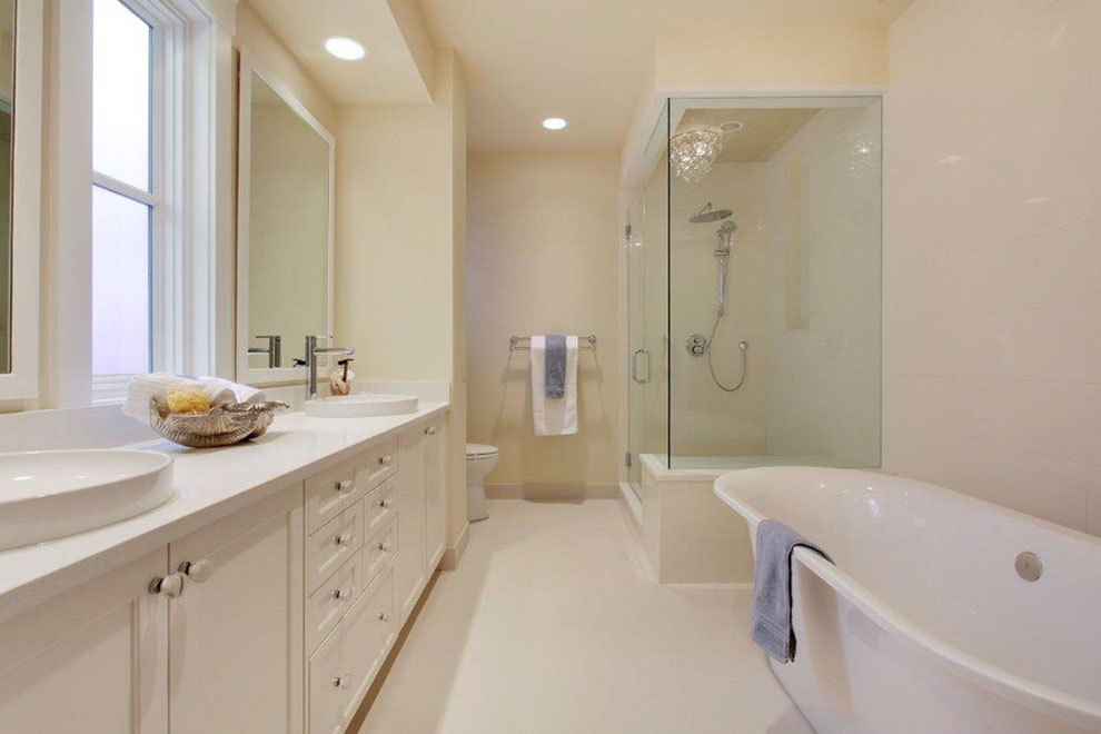 Image of Luxury primary ensuite bathroom interior with freestanding tub, double vanity, and spa shower by KHD Homes.