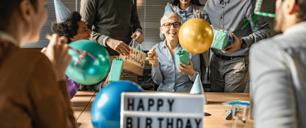 Coworkers together at a team room table