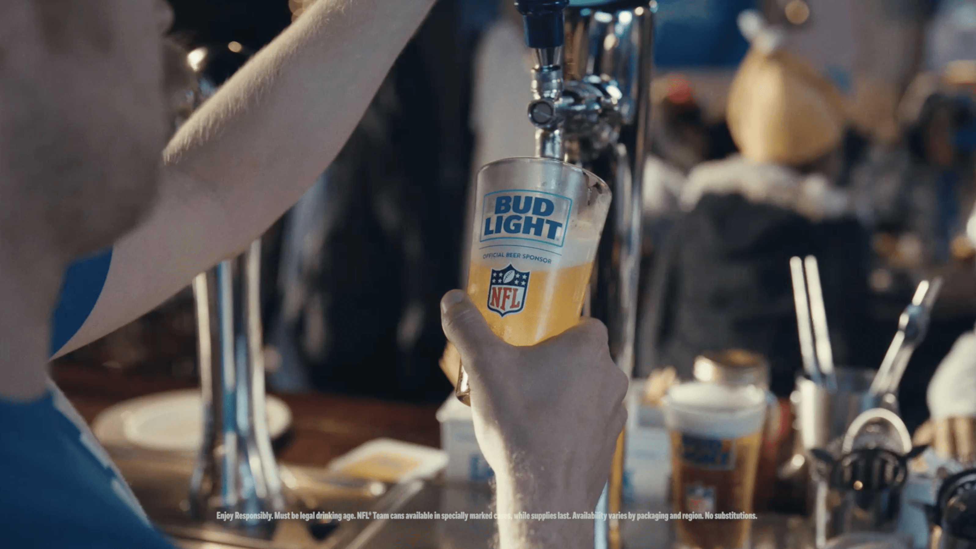 A close-up of a person wearing green-tinted glasses, with a serious expression and smooth skin.