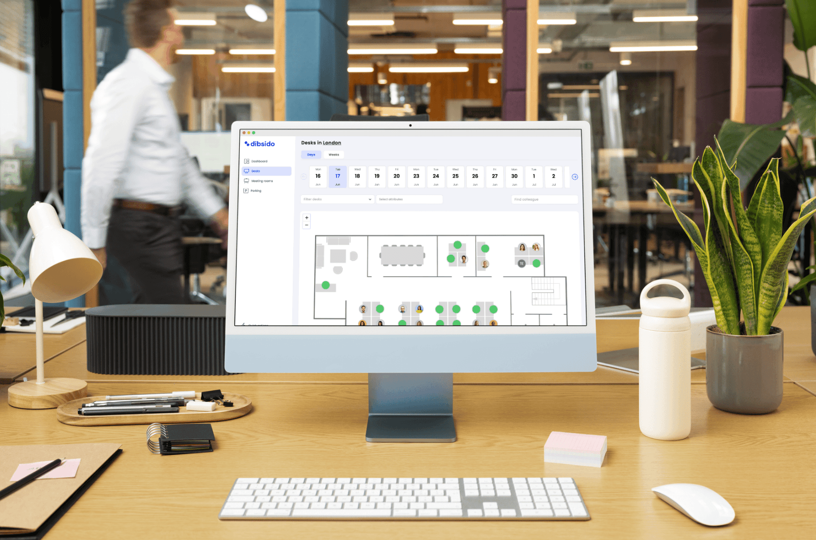 desk booking app in front off modern office