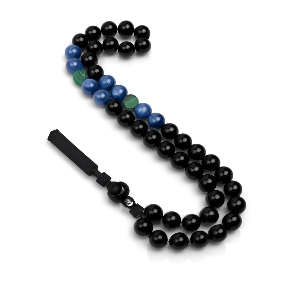 Black beaded necklace with a metal clasp on a white background